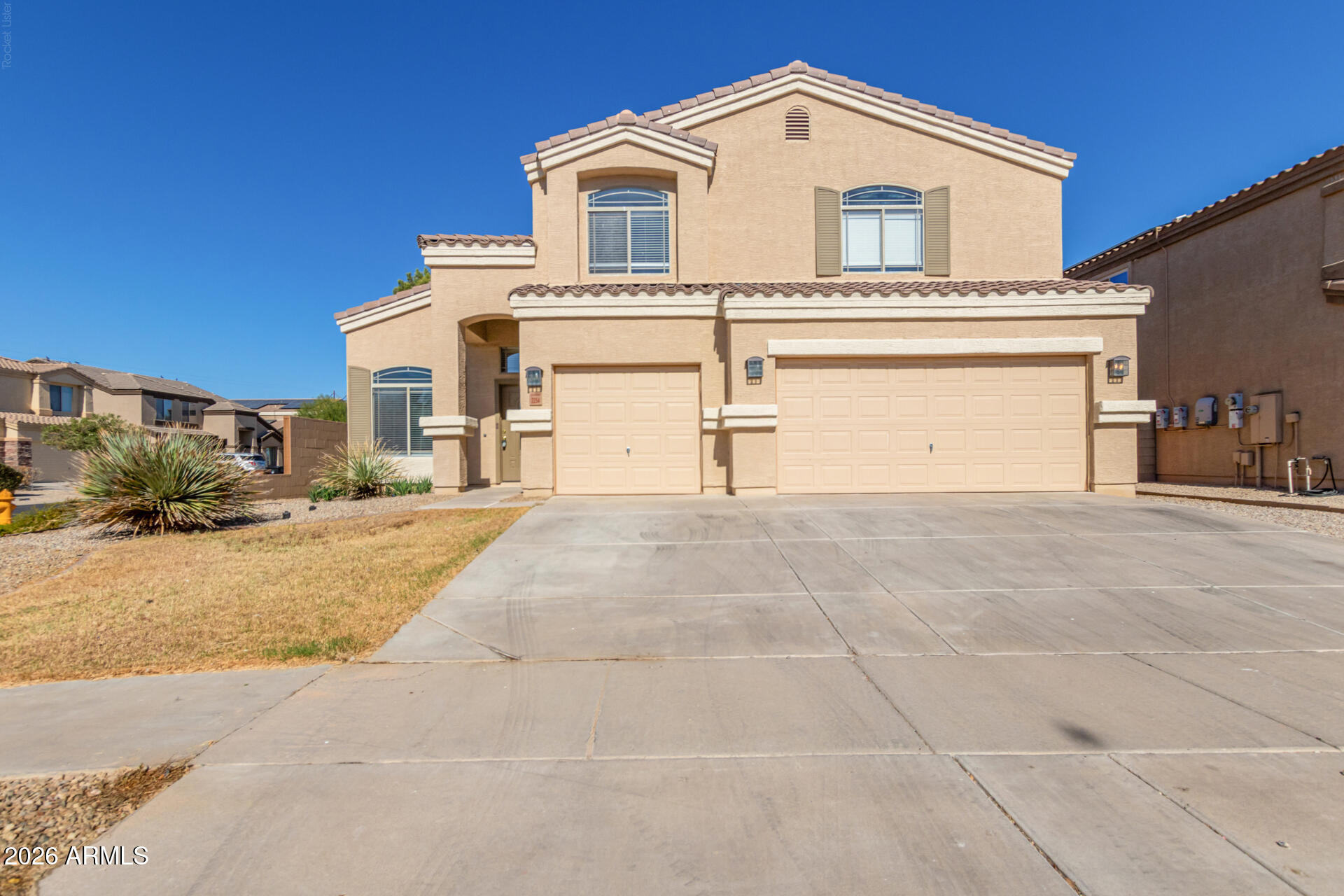 Exceptional two story home on a premium lot in Heartland of Coolidge! This spacious home features large front yard + extra large 3 car garage! Inside you will find an open  light & bright home, w/neutral paint, lush carpet in all the right places! Kitchen boasts of abundant white cabinetry & spacious granite counter tops, stainless steel appliances, recessed lighting, & huge island! The charming breakfast nook flows into the expansive room while the adjacent room can be 5 room or game room The large main room upstairs has its own balcony, walk in closet, large bathroom w/dual vanities! All rooms are good size. Outside you'll find this large canvas backyard w/covered patio awaits your creativity! Plus you love area! THIS LARGE CORNER LOT HAS ROOM FOR RV PARKING & BIG ENOUGH FOR POOL & MORE!