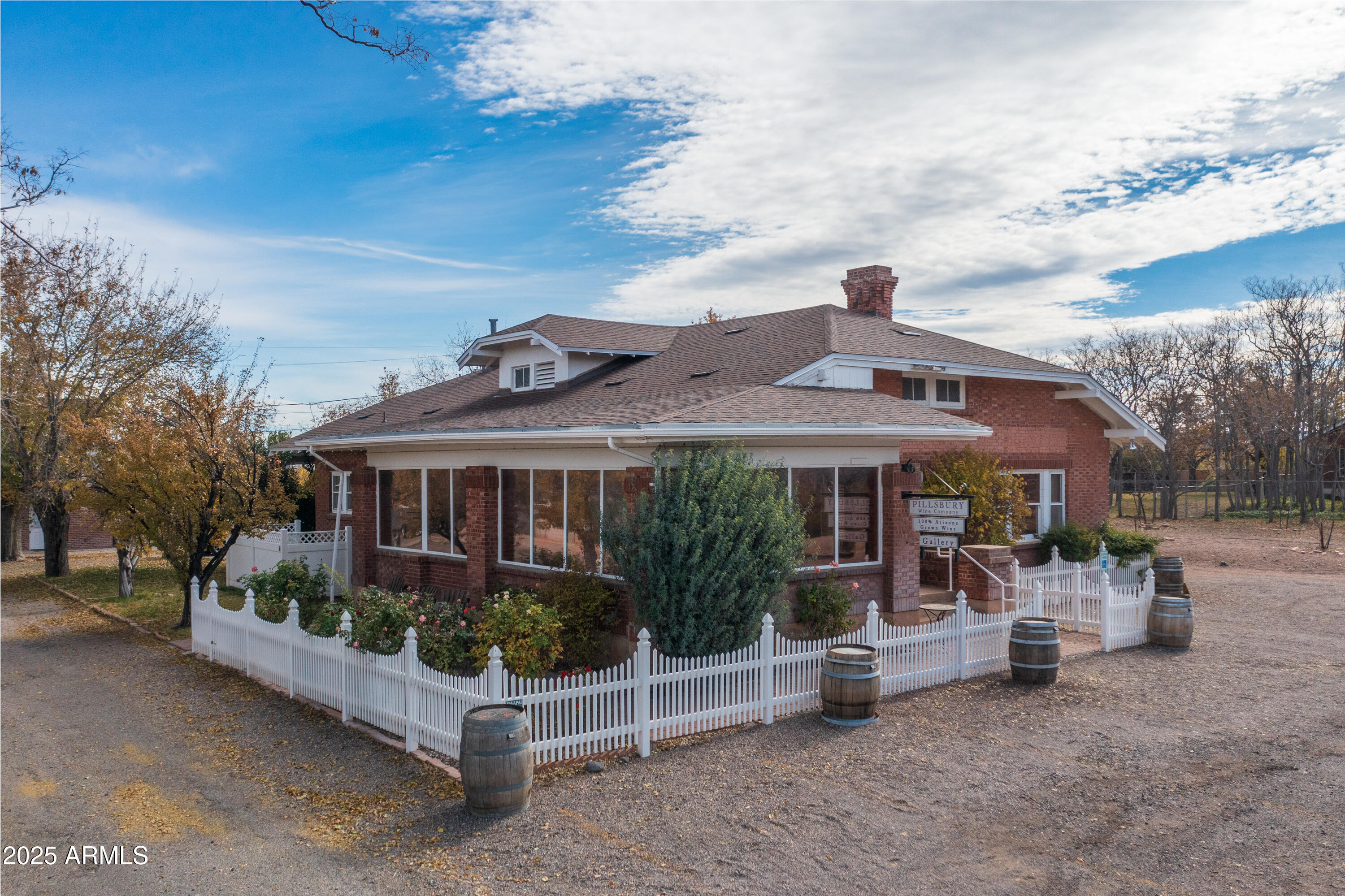 Write the next chapter of this historic property's glorious biography.  From an opulent early 20th century home to its most recent iteration as a sumptuous wine tasting room with modern finishes juxtaposed with carefully preserved vestiges of the past, flexibility and creativity abound. Spanning nearly two acres and nearly 4,200 SF of collective improvements, this property beckons a continuation of new experiences and visions, just as it nurtured those experiences from previous generations. Both structures are infused with a sophisticated, inviting ambiance, ensuring a refreshed aesthetic and reliable functionality for forward-thinking investors and entrepreneurs seeking a unique opportunity in this dynamic market. From a traditional bed and breakfast to a fine dining restaurant with the most beautiful courtyard in the city to an artist gallery to a mixed-use tenancy to traditional office, with room to grow, the options are endless. Whether you are a seasoned investor searching for your next value-add project, a retailer ready to expand, or an entrepreneur seeking a strategic foothold in Northern Arizona, this property delivers the footprint to turn your vision into reality. 315 S. Willard is more than just a building - it's a work of art. With sturdy construction, fresh upgrades, and practical floor plans, this asset stands ready to meet the demands of today's market and tomorrow's ambitions. Once you step foot inside this timeless space, you will clearly see that this is a place where history is not merely remembered, but truly lived.