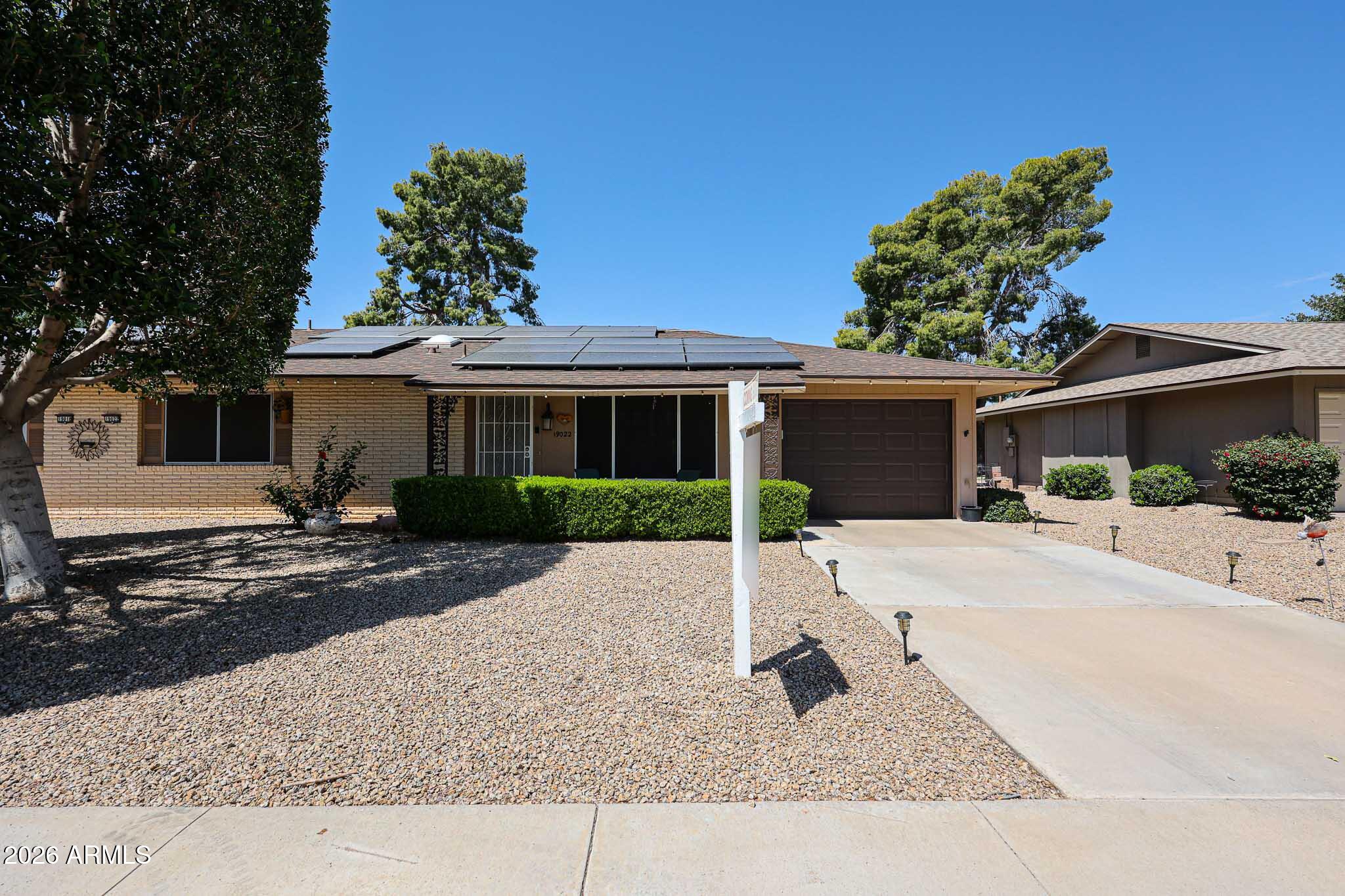 PHASE 3! LOTS OF GREAT UPDATES! CURB APPEAL! 2 bedrooms & 2 baths with a garage. Wonderful home with XL Arizona Room, low nap flooring (no carpet) throughout, no popcorn ceilings, Dual paned windows, Replaced HVAC (2024), Replaced roof (2021) replaced garage door (2026), Updated Kitchen,  large peninsula with space for seating, Updated Shaker cabinets (most with roll out shelving), quartz counter tops and stainless appliances, Conveniently located to grocery shopping, Marinette Recreation Center, medical offices, major league spring training facilities, professional football stadium and enjoy easy access to the freeway. Come and enjoy this home as a winter getaway or full-time residence. Small pets are welcome. Inside laundry room with Workbench. Solar home!