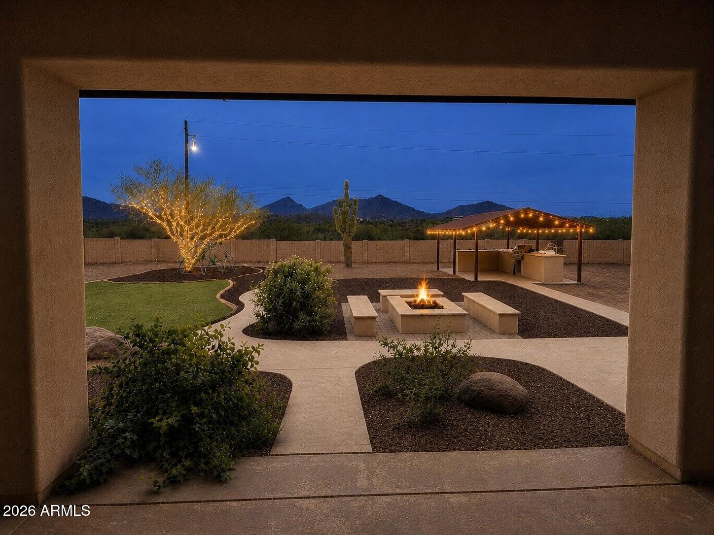 Experience true desert sanctuary living with the Arizona Preserve as your borrowed-backyard. Custom 4bedroom, single level ranch home located on private cul-de-sac, offers rare independence with 5-home well-share, no HOA, and a flat usable acre with room to live your lifestyle your way. Outside- a massive RV gate, covered outdoor kitchen with built-in BBQ, wood-burning fire pit & panoramic views. Inside- soaring vaulted ceilings & open-concept layout create an expansive living space. Kitchen features granite counters & pantry with seamless flow into dining & living spaces. Flexible 4th bedroom with custom cabinetry, sink, & private entrance works beautifully as a home office, studio, or workshop. Crisp desert evenings, a canopy of star & endless views -- where luxury meets desert charm.