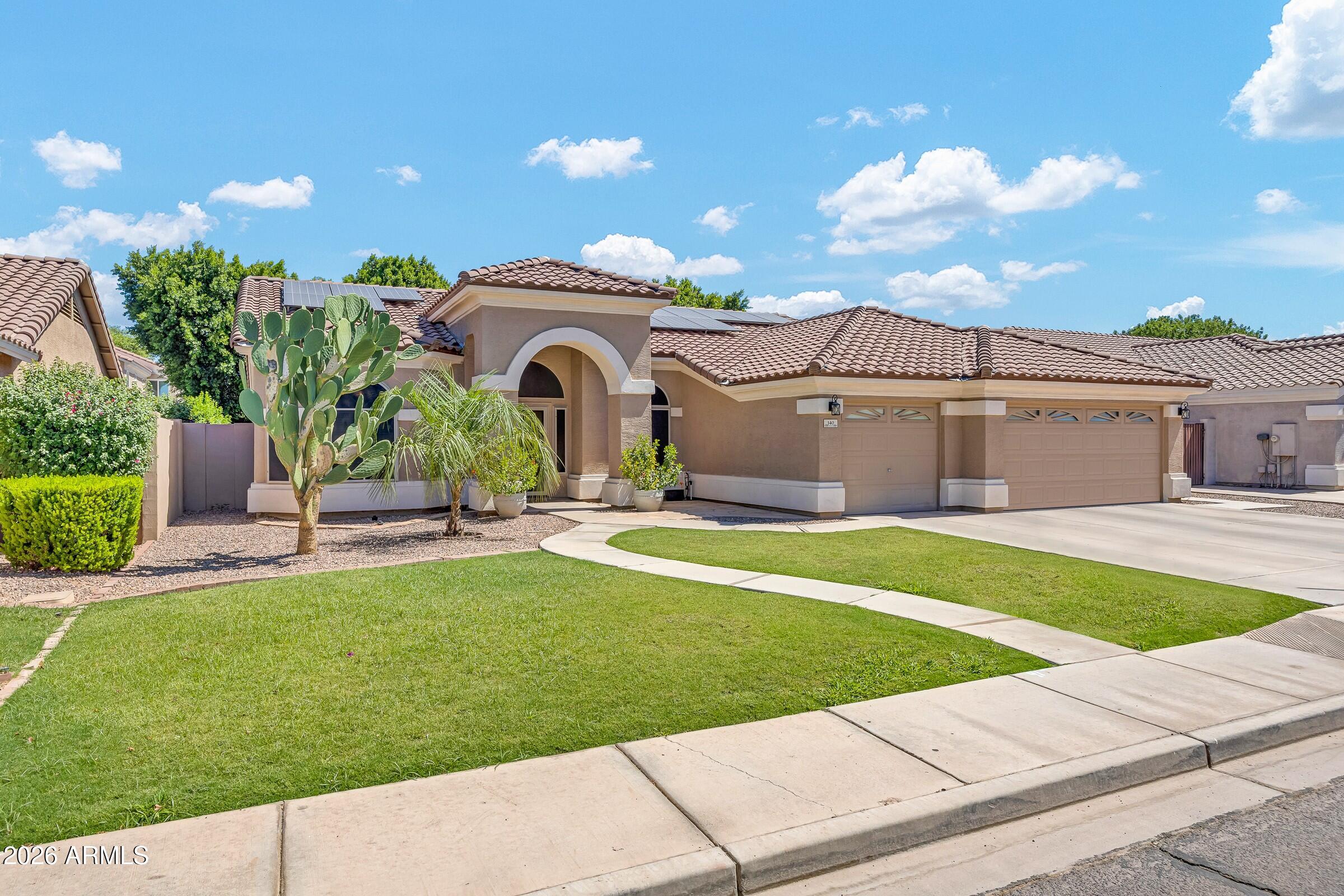 Private Paradise... minutes-from-Downtown Gilbert. This impressive property features a beautifully landscaped exterior, newer roof and home security screens to provide immediate peace of mind.  Wood and tile flooring complement a layout boasting beautifully remodeled showers and a laundry room with tailored cabinetry.  The sparkling Pebble Tec diving pool serves as the centerpiece of a private oasis, complete with a Katchakid cover and custom storage shed for pool equipment. Hobbyists will love the immaculate, climate-controlled three-car garage, featuring epoxy floors, insulated doors, a custom workbench, and a dedicated AC unit. High-value upgrades include energy-efficient, owned solar panels, a water softener, and so much more.