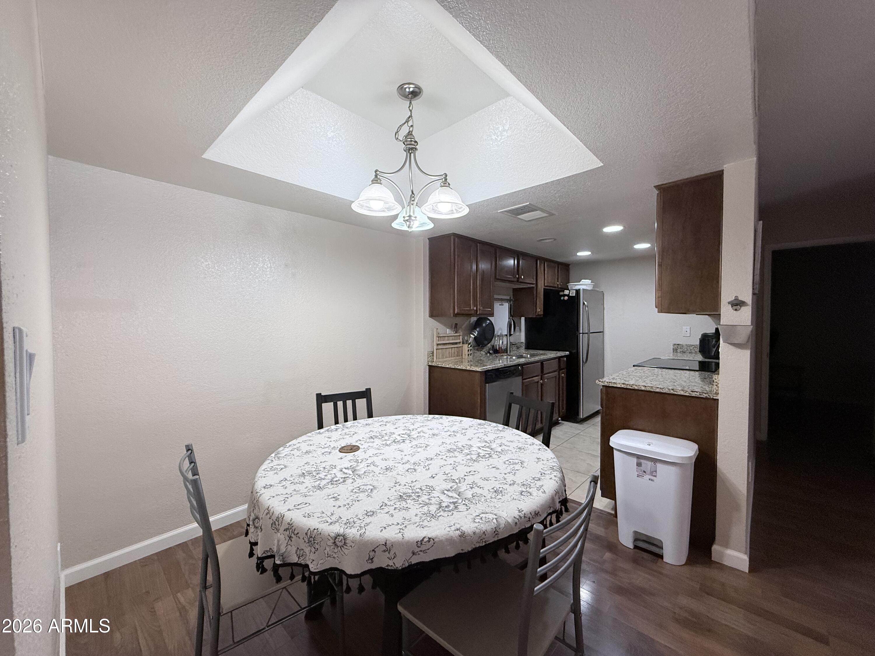 Fantastic opportunity near Arizona State University! This 2-bedroom, 2-bathroom condo with 1 covered parking space is ideally located in the heart of Tempe, just minutes from ASU, shopping, dining, and major freeways.  HOA includes water service, and the refrigerator, washer, and dryer are all included, making this a truly move-in-ready property. Conveniently located across from Safeway and only a short drive, bike ride, or walk to campus. With its prime location near ASU and strong rental demand in the area, this property presents an excellent opportunity for both investors and owner-occupants. Whether you're looking for a primary residence, a home for an ASU student, or a long-term investment property, this condo offers exceptional value in a highly desirable location. Don't miss this affordable Tempe opportunity!