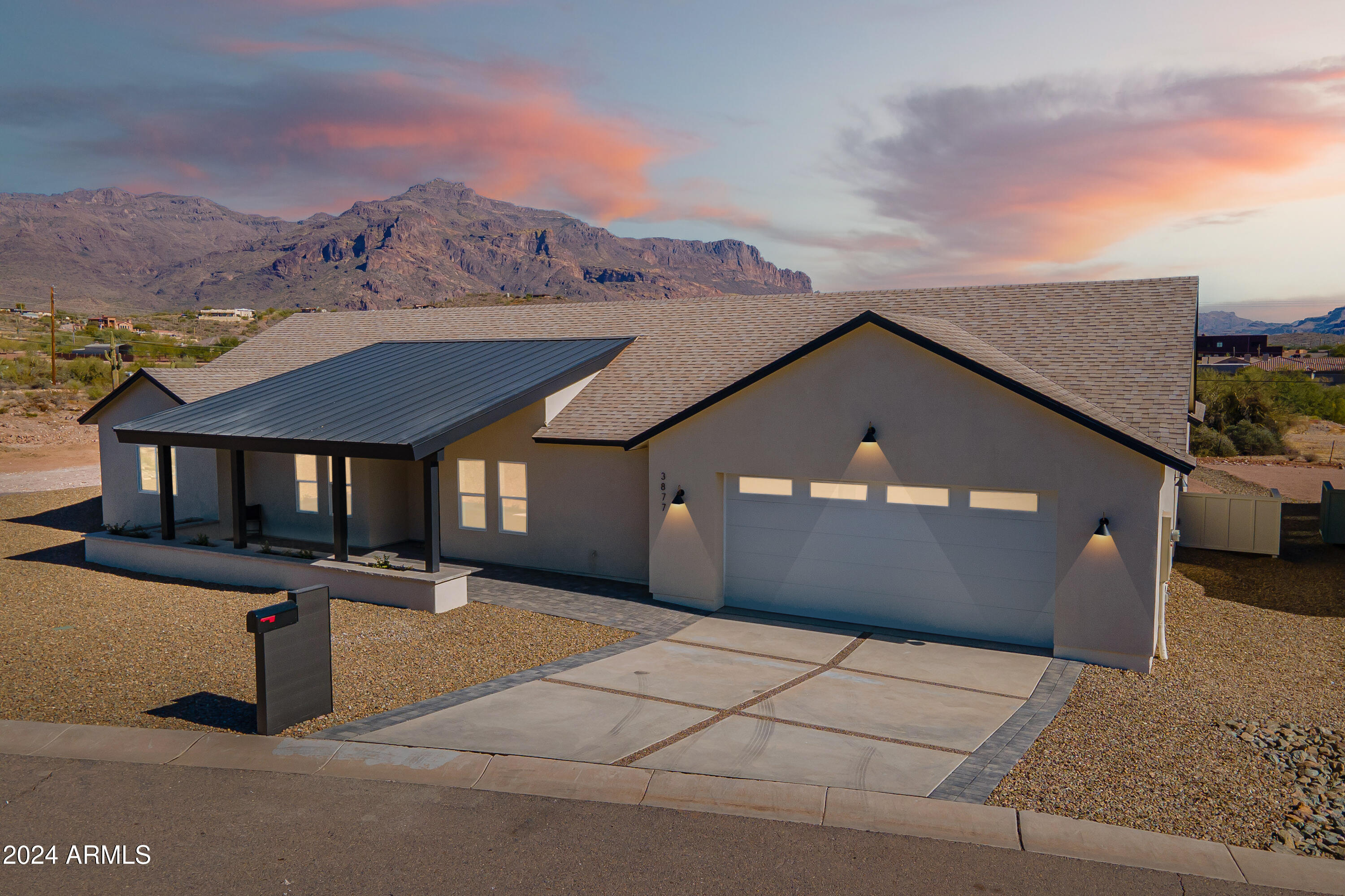 Welcome to Montana Dorada, the best kept secret in Gold Canyon Arizona. This single level new build home is part of an exclusive Modern Farm Desert Collection. Offering paved roads, quick access to the US 60, close to shopping and dining, complete with breathtaking views of the iconic Superstition Mountains at every turn. Offering 2989 livable SF, 4 bedrooms, 3 bathrooms, a large kitchen island, beverage bar, & butler's pantry. This split floorplan offers a large owners suite and guest ensuite both with private access to the large, covered backyard patio. All tile throughout with light earthy tones, and soft natural accents inspired by the Arizona desert, and designed to complement every style. This home comes with an oversized 2 car garage complete with epoxy floor and so much charm.