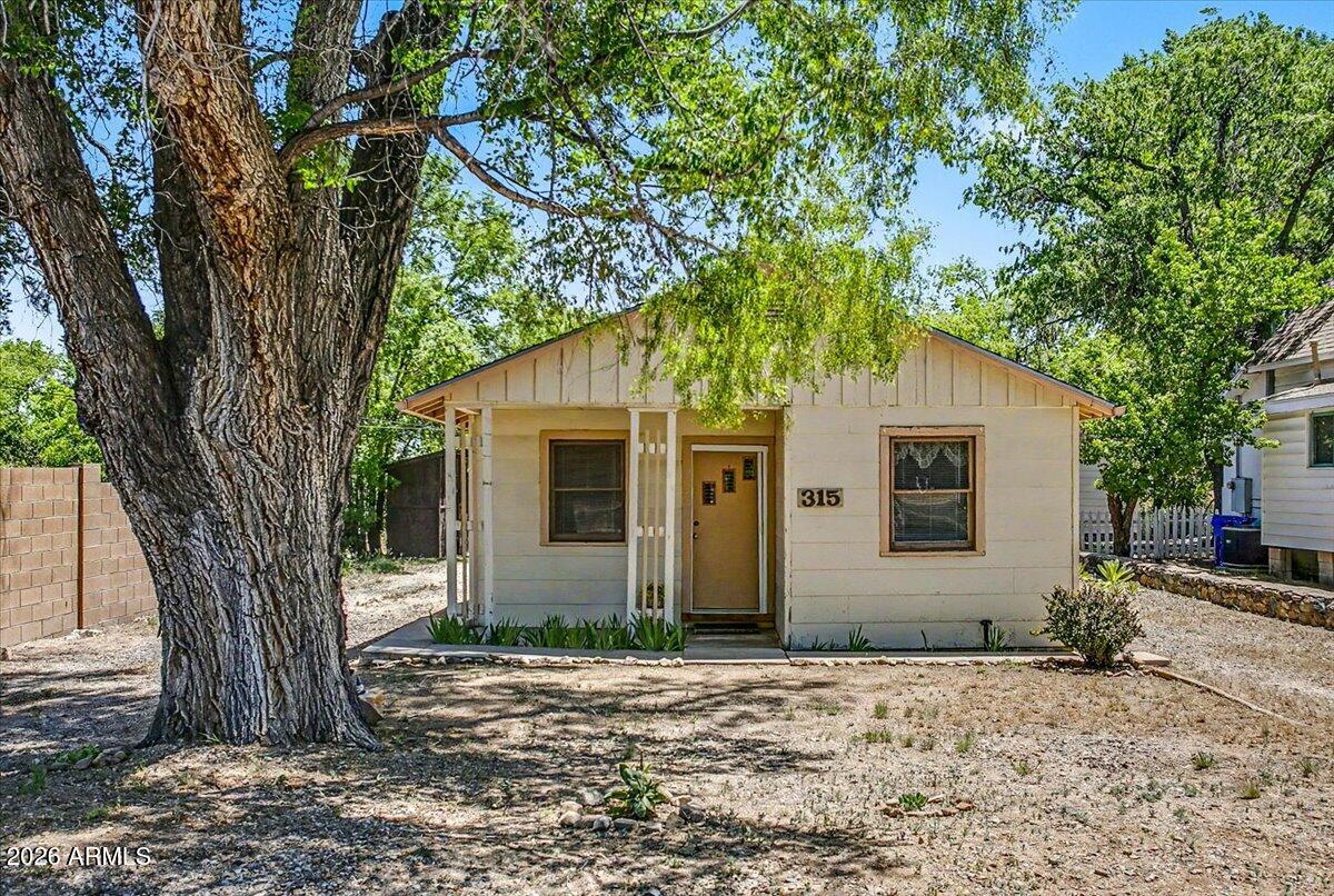 This well-maintained 1939 duplex is a great affordable investment opportunity, just steps from Prescott College and a short walk to the shops, restaurants, and character of historic downtown Prescott. Both units are move-in ready, sitting on a level lot with plenty of parking. Unit A (590 sq ft) features a welcoming front porch, full kitchen, 1 bedroom, a versatile bonus room with half bath, and a dedicated laundry room. Unit B (432 sq ft) is a cozy retreat with a full kitchen, 1 bedroom, a gas fireplace to take the chill off those cool mountain evenings, a 3/4 bath, and stackable washer/dryer in-unit. Three on-site storage sheds offer room for all your gear. A rare chance to live with personality and convenience right in the heart of everything Prescott has to offer.