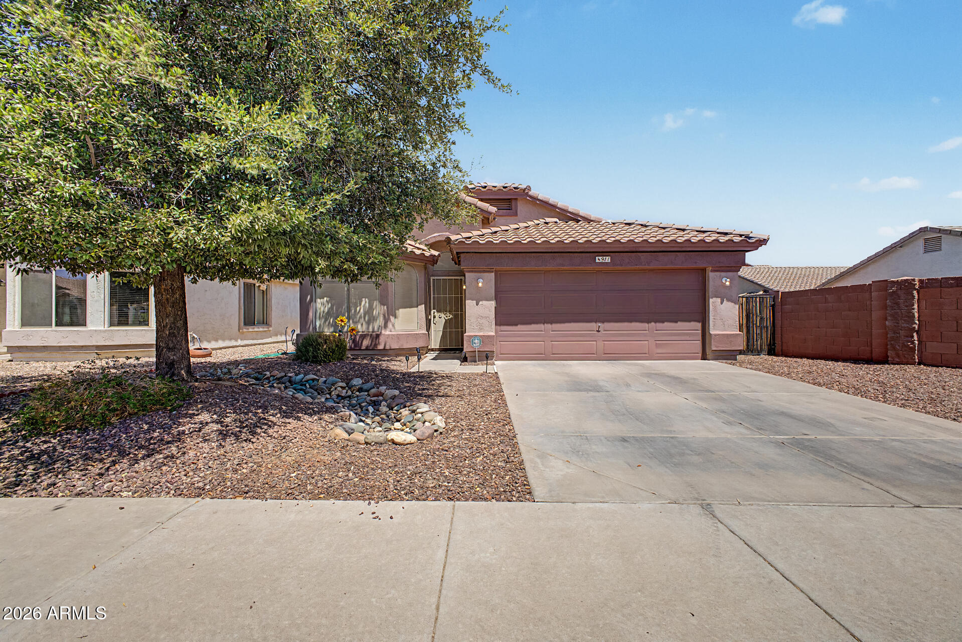 Discover this move-in ready home on a premium greenbelt lot in the gated La Fortina community, offering added privacy with no direct neighbor behind. Ideally located within walking distance to Skyline High School and the City of Mesa public pool, this home combines comfort, convenience, and an exceptional East Mesa lifestyle. Inside, you'll find fresh interior paint, vaulted ceilings, plantation shutters, luxury vinyl plank and tile flooring throughout, and surround sound with in-ceiling speakers. The open-concept great room creates a bright, welcoming space that's perfect for everyday living and entertaining. The beautifully updated kitchen features granite countertops, a large island with breakfast bar seating, abundant raised-panel cabinetry with hardware and crown molding, stainless- steel appliances, double wall ovens, and generous prep space for cooking and gathering. A soft water system, reverse osmosis drinking water system, and additional laundry room cabinetry add convenience and functionality. The spacious primary suite offers a relaxing retreat with a bay window, walk-in closet, and plenty of natural light. Step outside to enjoy Arizona outdoor living with a covered patio featuring ceiling fan and built-in speakers, an extended paver patio, and a large grass backyard overlooking the greenbelt through a partial view fence. The private setting makes it ideal for entertaining, family gatherings, pets, or simply relaxing outdoors. Additional features include an RV gate, a 2-car garage with built-in storage cabinets and service door, and a premium lot within one of East Mesa's desirable gated communities. If you're searching for a home with a greenbelt lot, RV gate, gated community, updated kitchen, luxury vinyl flooring, no neighbor behind, large backyard, and a convenient East Mesa location close to schools, parks, and recreation, this home is a must-see.