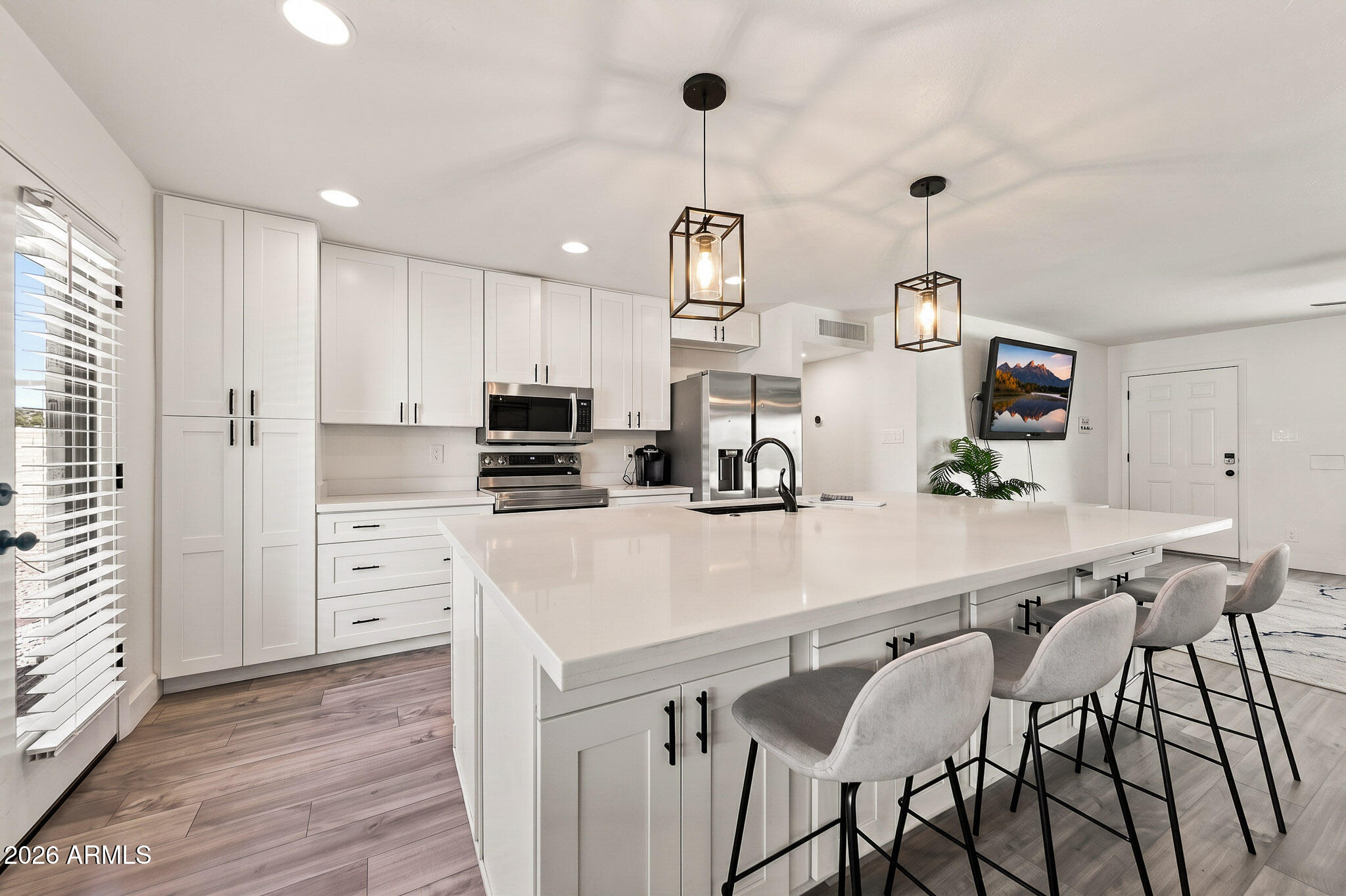 This gorgeous home is a complete down to studs renovation located in the heart of Old Town Scottsdale. Situated on a corner lot with north/south exposure, the property offers a major peace of mind with a new 2026 HVAC, 2026 tankless water heater, and  2022 pool, roof and windows. Having previously served as a successful winter Airbnb, it is to be purchased fully furnished.
The interior features curated interior designer colors with a clean, off-white palette accented by black hardware. The functional layout features an open great room that flows directly into the chef's kitchen, making it ideal for hosting. The private backyard features a heated pool, covered patio with a built-in outdoor grill. This turnkey home is waiting for you.