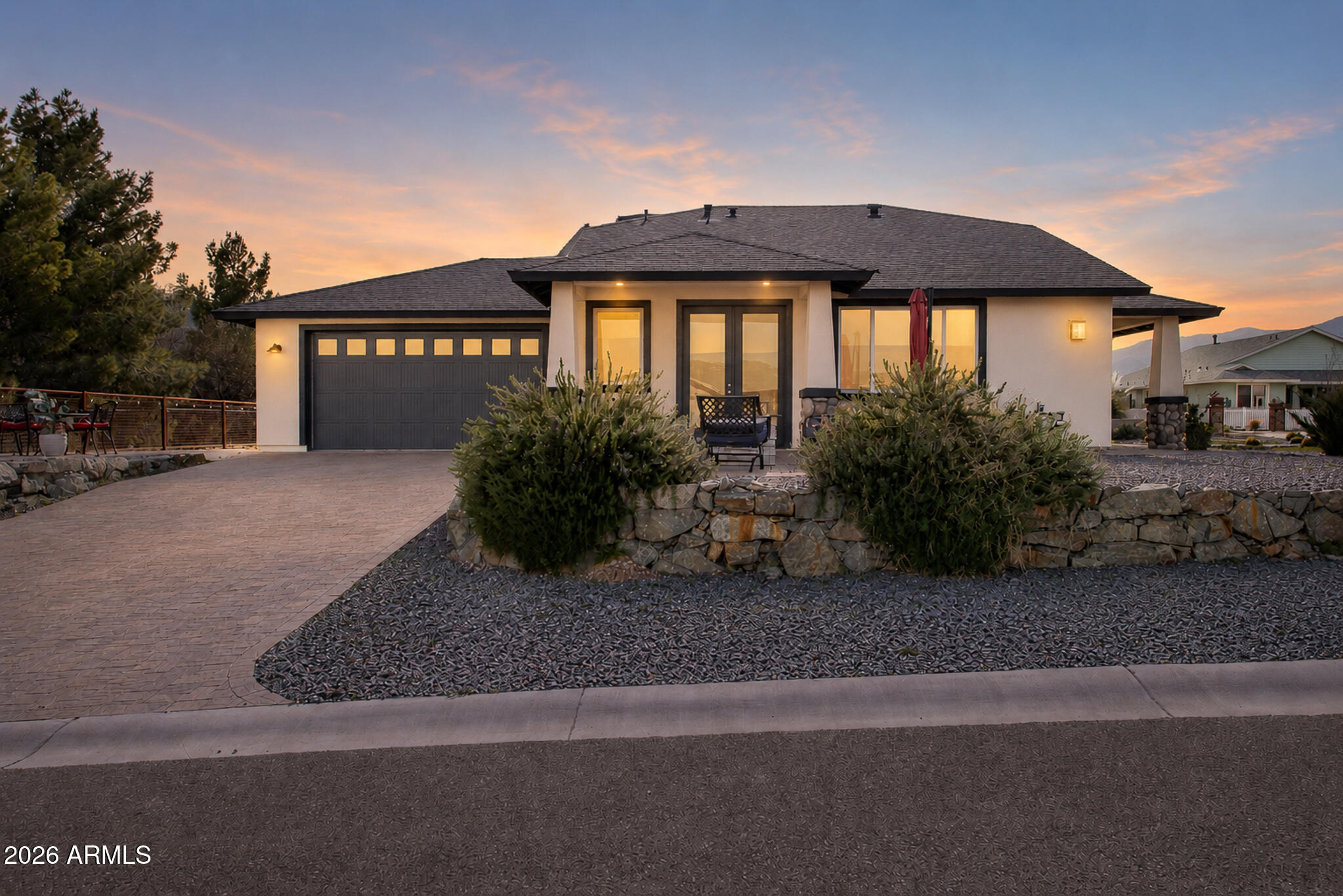 This stunning Craftsman home, built in 2022, offers the perfect blend of modern comfort, scenic beauty, and income potential. Ideally located just above Old Town Cottonwood and directly adjacent to the access trail leading down into Old Town, the property captures sweeping views in every direction, including Sedona, Sycamore Canyon, and Jerome.
Situated in a non-HOA community with no rental restrictions, this home allows both short-term and long-term rentals and is already a proven, meticulously maintained, successful short-term rental with consistent 5-star reviews.
Inside, vaulted ceilings and a corner fireplace create a warm and inviting great room. Corner kitchen windows beautifully frame Sedona views, while the kitchen features gorgeous cabinetry, premium countertops, Stainless steel appliances and a spacious walk-in butler's pantry with exceptional storage. The thoughtfully designed split 3-bedroom, 2-bath floor plan provides excellent privacy. The primary suite includes a large walk-in closet and an elegant walk-in shower. The two guest bedrooms are generously sized and thoughtfully separated by the guest bathroom for added comfort and privacy. Designed for efficiency, the home carries Energy Star and Indoor Air Quality Plus designations and features a cathedralized attic with spray foam insulation for exceptional energy performance. Need to work from home? Enjoy 1-gig fiber optic internet availability.
The exterior features a beautiful paver driveway and patios with two separate sitting areas, low-maintenance landscaping with synthetic grass, and paver walkways that enhance curb appeal.
This is an exceptional home in a desirable location you do not want to miss. The owner may consider selling fully furnished with the right offer.