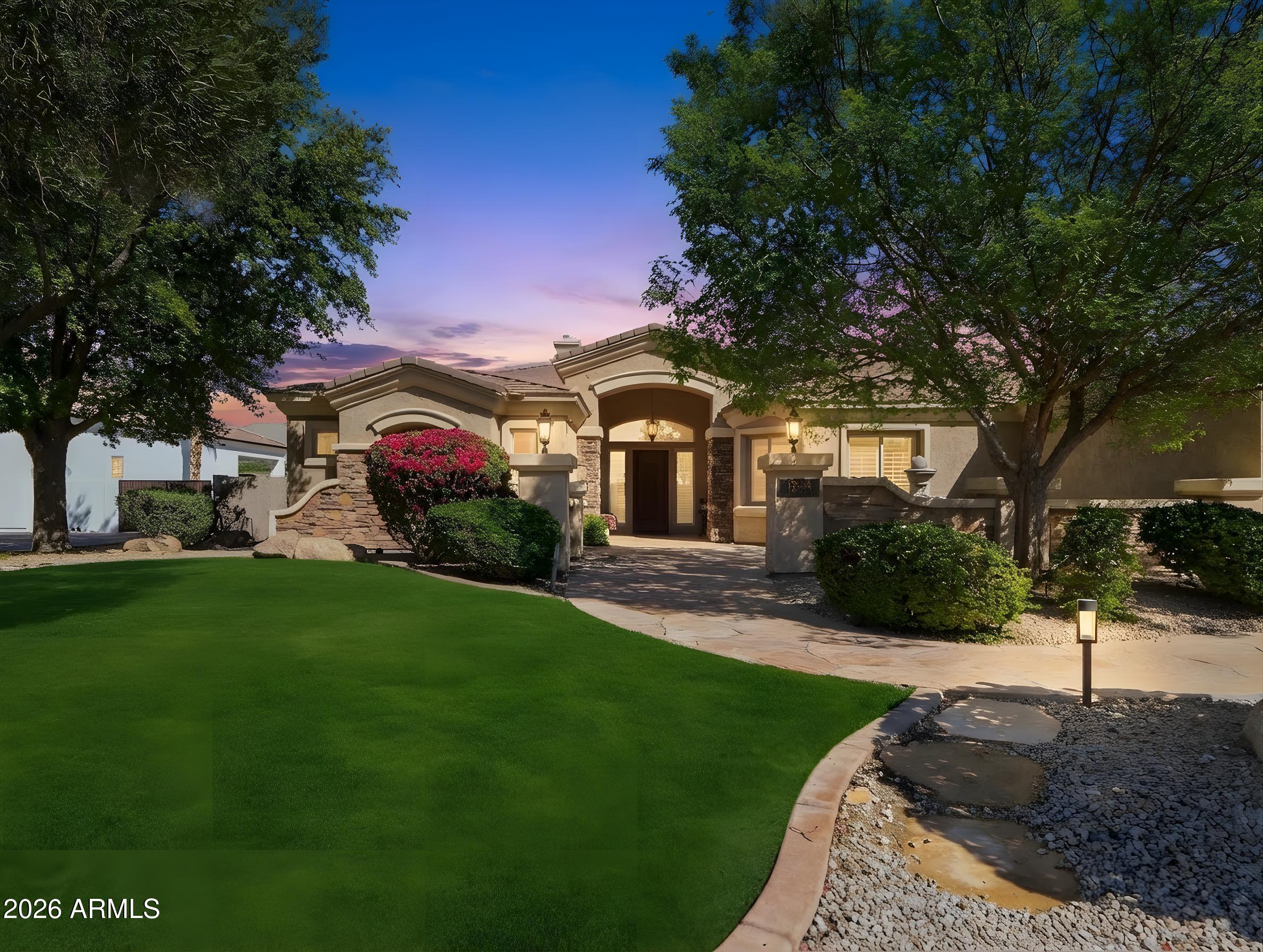 Beautiful custom home in a gated community. LOOKING FOR OFFERS. A real bargain at $230 per sq. ft. Features covered garage spaces for over 6 vehicles, including a RV GARAGE, perfect for your recreational vehicles or GOLF Simulator. Inside you have Travertine stone floors, granite counter tops, all new kitchen appliances, kitchen island, arched doorways, decorative niches and two fireplaces. Each of the three bedrooms has their own private full bathroom, including the large owner's suite. The owner's suite has His & Her walk-in closets, His & Her separate toilets and a jetted tub. GIVE US AN OFFER TODAY !! Great Value for this gated community...