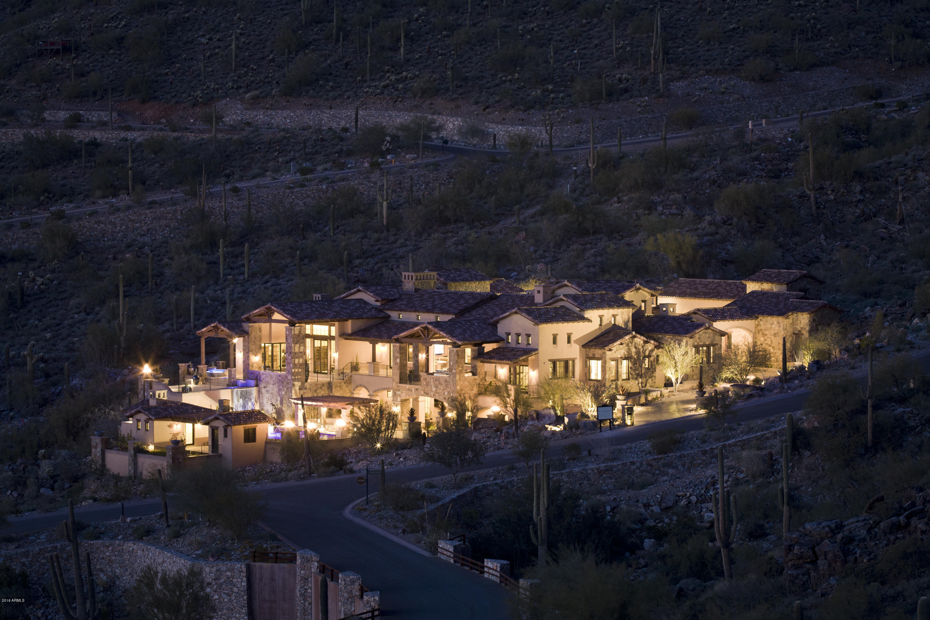 Please see video tour in photo tab.    A neighborhood defined by distinctive and proud architecture. Located in the
“Summit” of Silverleaf offering unequal natural beauty with dynamic views of the valley. Detailed craftsmanship and artistry are abundant upon entering the Grande open floor plan, adorned with 4000 lb hand whipped lighted beams, chandeliers,full wine cellar in basement, marble and wood floors, and sunken bars. A true entertainers dream with multiple automated doors accessing Arizona’s outdoor lifestyle.  Chef’s kitchen fitted with custom cabinetry and artisan back splashes, solid surface counter-tops and wolf /subzero SS appliances. Owners retreat features
marble floors, tranquil sitting area w/wet bar and automated 90 degree opening to private spa, decorative