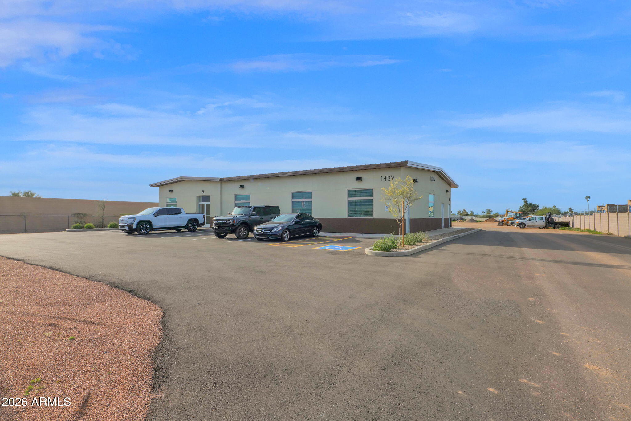 Amazing GR zoned property with over 150' of frontage on Old West Highway and over 4.5 acres of flat, useable land! Brand new 4000sqft commercial building that contains four air conditioned offices, large showroom/lobby, public and private bathrooms, 60' X 30' insulated and temp controlled shop, emergency shower, two large bay doors, professionally landscaped and much more. All utilities on site including electric, water and oversize septic as well as infrastructure for additional buildings. Entire lot is gated/fenced including electric entrance gate.  Plenty of room for expansion or equipment of any kind.  This property is turnkey and ready to go for most any type of business or even add multi family residential if desired. Great property and even better location close to US 60.