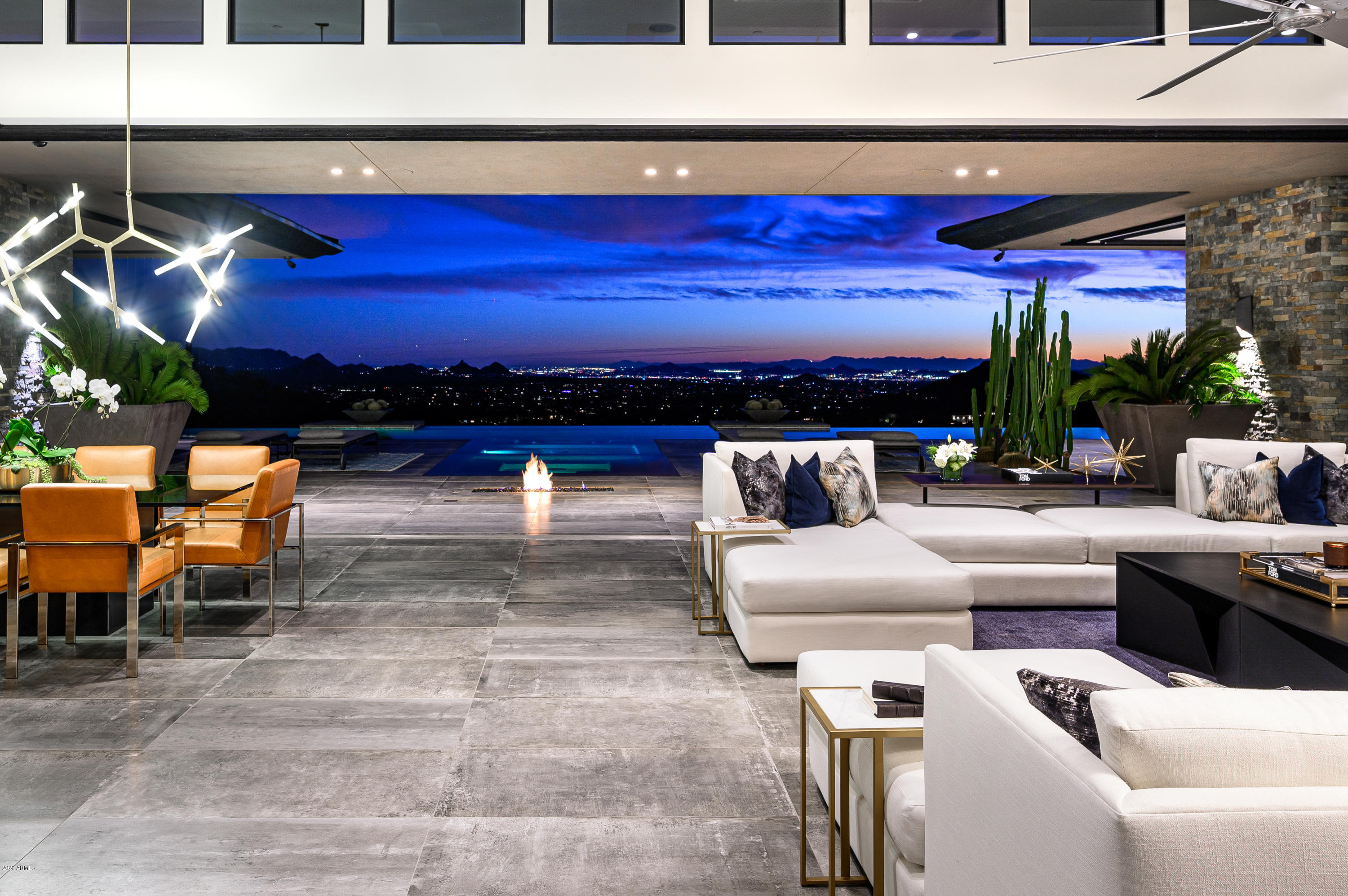 Opulent CONTEMPORARY 9.91 ACRE ESTATE nestled into a gated, private reserve in Desert Mountain's upper canyon Saguaro Forest. Unparalleled forever Valley-Wide Views, City Lights, Mountains and Sunsets. Disappearing Glass Walls spilling onto resort living; Alfresco entertaining overlooking a 3-sided infinity pool, spa, rainfall water feature and a linear fire pit. One-level main home boasts Great Room, Modern Chef's Kitchen, dramatic Wine Wall, Full-Service Wet Bar, Master Retreat, 2 Guest Suites and Executive Office. Guest Wing houses Kitchenette, Media Room, 4 chic Guest Suites (2 on main level) each with private patio. Lower level guest retreat access via floating staircase with soaring glass window-wall backdrop or private elevator. Furnishings Available Separately. *Chandelier in Arizona Room is a family heirloom and does not transfer with the home*