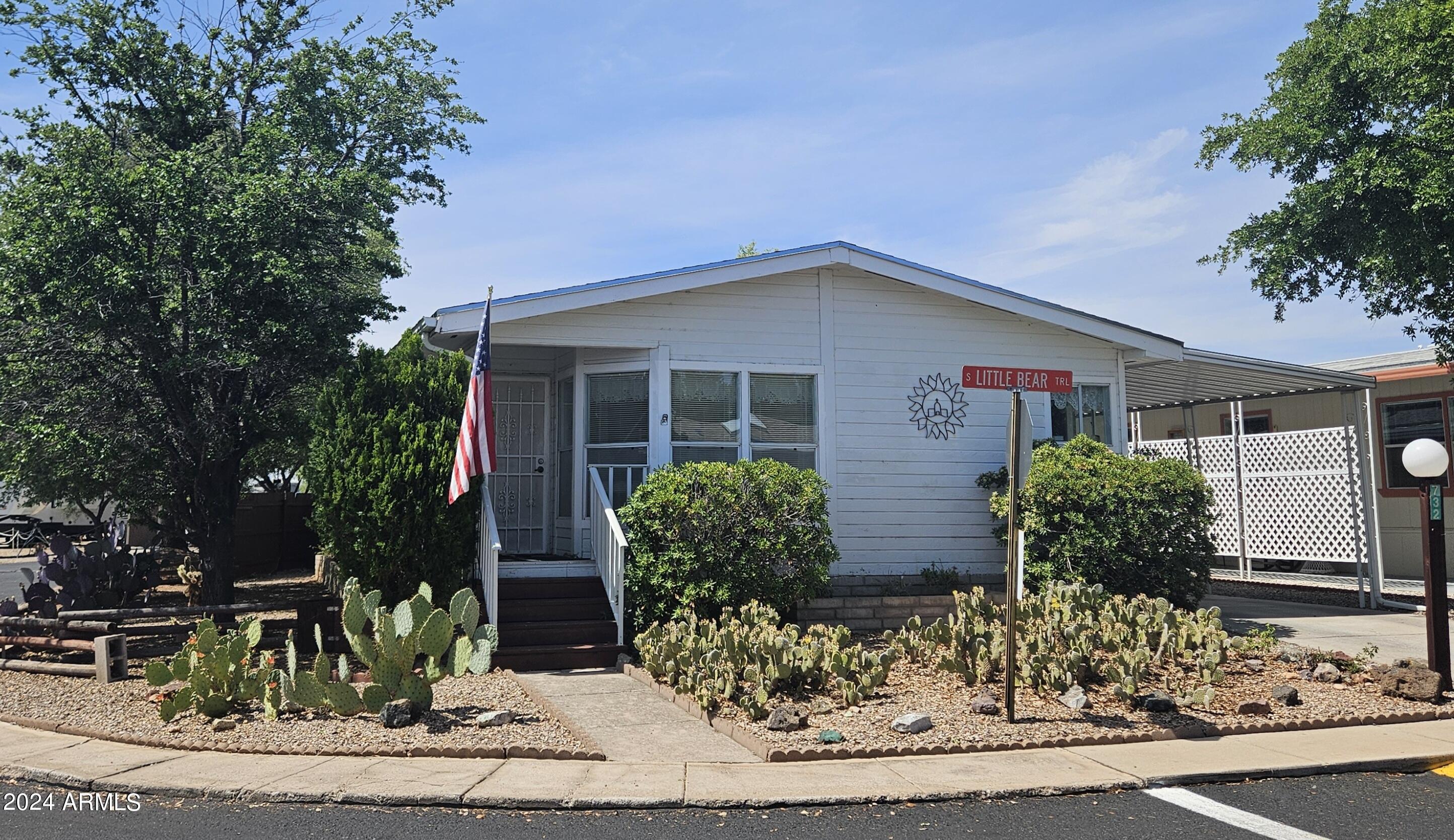 2 bedroom, 2 bath home on a larger corner lot close to both clubhouses. Gated community. 2 large bedrooms, large utility room and master bath. 2 walk in closets Tall wooden privacy fence around the backyard. A small garden area and private sitting area.