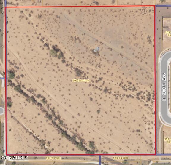 County land Ready to be develop into your next community. 10 acre parcel ready to be split into 5-2 acre parcels to stay in county or to be annexed into city of surprise and built into a community of up to 25-30 homes. County has indicated that the Wash can be diverted at west entrance to run south along property line   to the south side of property then go east to meet the existing wash on the south east end of property.