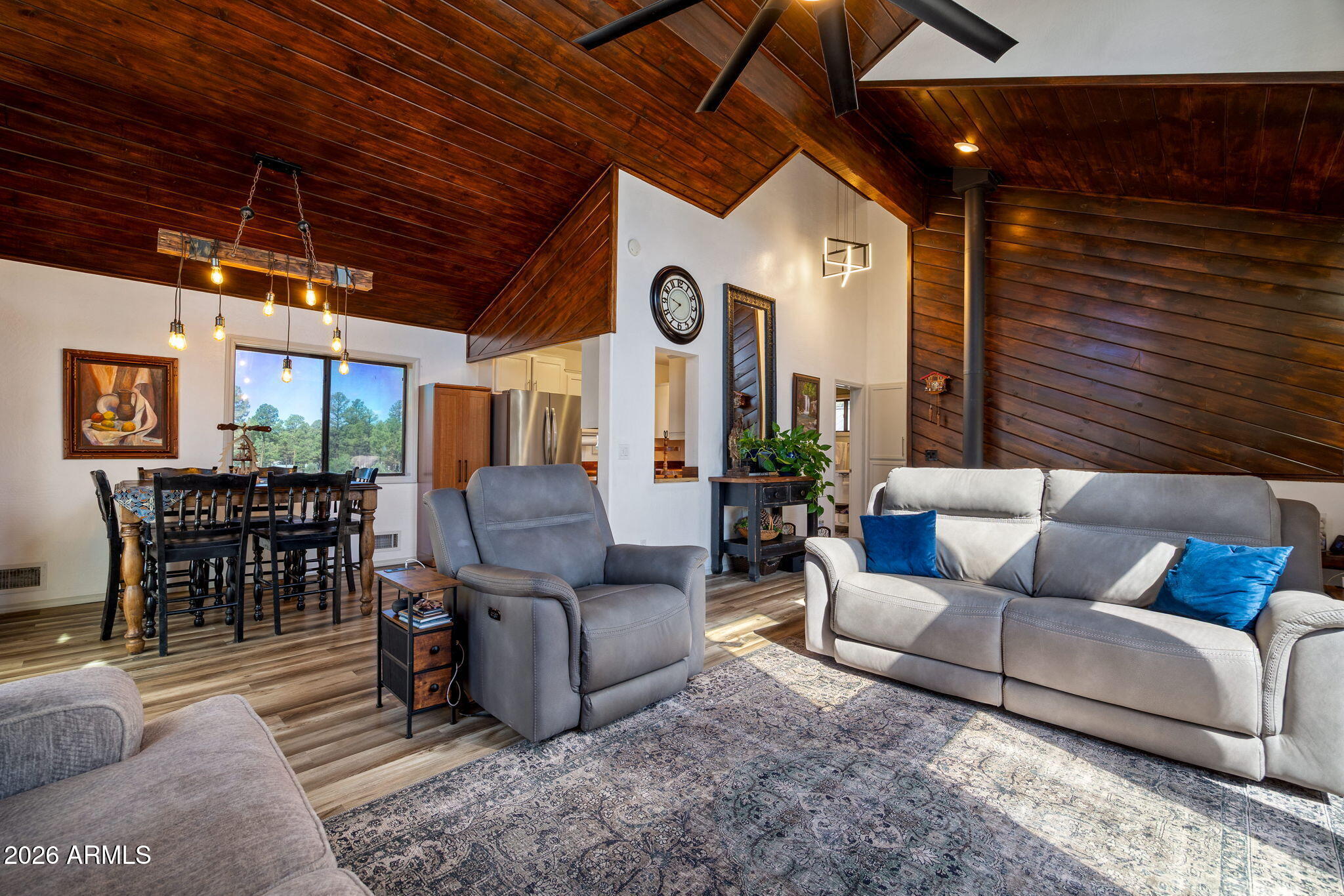 Cozy, rustic charm meets modern comfort in this lock-and-leave retreat at Mogollon Airpark (AZ82) w/direct taxiway access and a private hangar! Featuring 3 bedrooms, 2 baths, wood stove, vaulted knotty pine ceilings and tasteful updates throughout, this is the perfect mountain getaway. Recent improvements include new kitchen countertops, updated bathrooms, fresh interior and exterior paint, the addition of a convenient mudroom and an outdoor storage shed.
Situated on a spacious 0.82-acre lot, you'll enjoy the beauty of the White Mountains from either the lower-level deck or the expansive second floor deck, with access from the master bedroom and living room. There's even a fully enclosed dog run adjacent to the house for your pets. 
The impressive 50' x 40' hangar features an accordion door w/42 foot door opening, finished concrete floors, a mini-split heating and cooling system, utility sink and its own bathroom--ready for your aircraft, workshop, or both.

You'll love being at 6658' elevation with mild summers and winters and just 90 nautical miles northeast of Phoenix. The area boasts many dining options, grocery, hardware, and other shops. Abundant outdoor activities include County and State parks, ATV trails, hunting, hiking, boating, and lakes for fishing less than 30 minutes away in every direction.

Mogollon Airpark is a vibrant private residential airpark with a 3420' asphalt runway (plus an approx 1000 feet on each end for takeoff & overruns), and an active EAA chapter hosting events including BBQs, happy hours, and breakfast fly-ins. The community offers a clubhouse, tennis & basketball courts, picnic tables, gas grills, and a play area for kids.