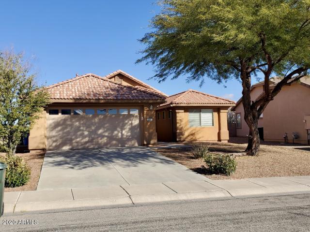 Current owner doesn't love the AZ heat, so after upgrading features of the home they have decided to move.  Ready to move in 3 bedroom, 2 bathroom home in Coronado Crossings. This property sits above neighbors, with a greenbelt area behind home and a recently landscaped backyard.  Block wall has view panels to increase that open feel. Inside there is open concept living, with spacious laundry area (lots of room to add cabinets or a wall locker system), large Master Bedroom with back patio access, gas fireplace, covered patio with wonderful views, new landscaping in front and back, solar tubes, partial gutters added, new water softener, and MORE!!!