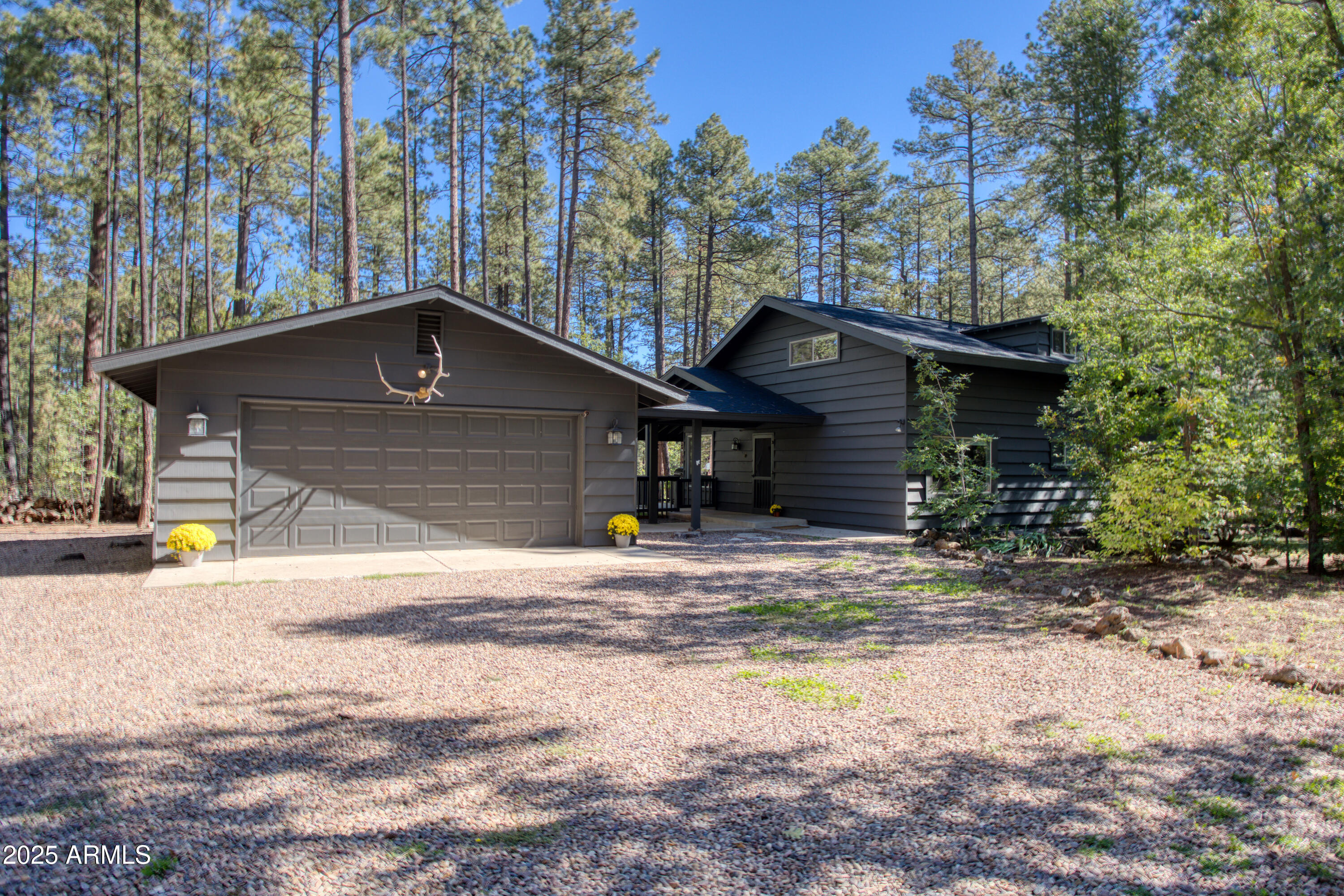Guard gated White Mountain Summer Homes. Extensively remodeled in 2019. 4 bedrooms. 2 bath plus den/office. Roof, plumbing, kitchen, baths, flooring, windows, septic all done in 2019. A/C! Beautiful appointments and fixtures. Skylights and open floorplan make this cabin cheerful and great for entertaining. Covered deck with fireplace. Grassy play area and grassy dog run. Large 2 car garage. Granite countertops, kitchen island, s/s appliances. .65 Acres. Most furniture is available by separate agreement. Turnkey and ready to sell!