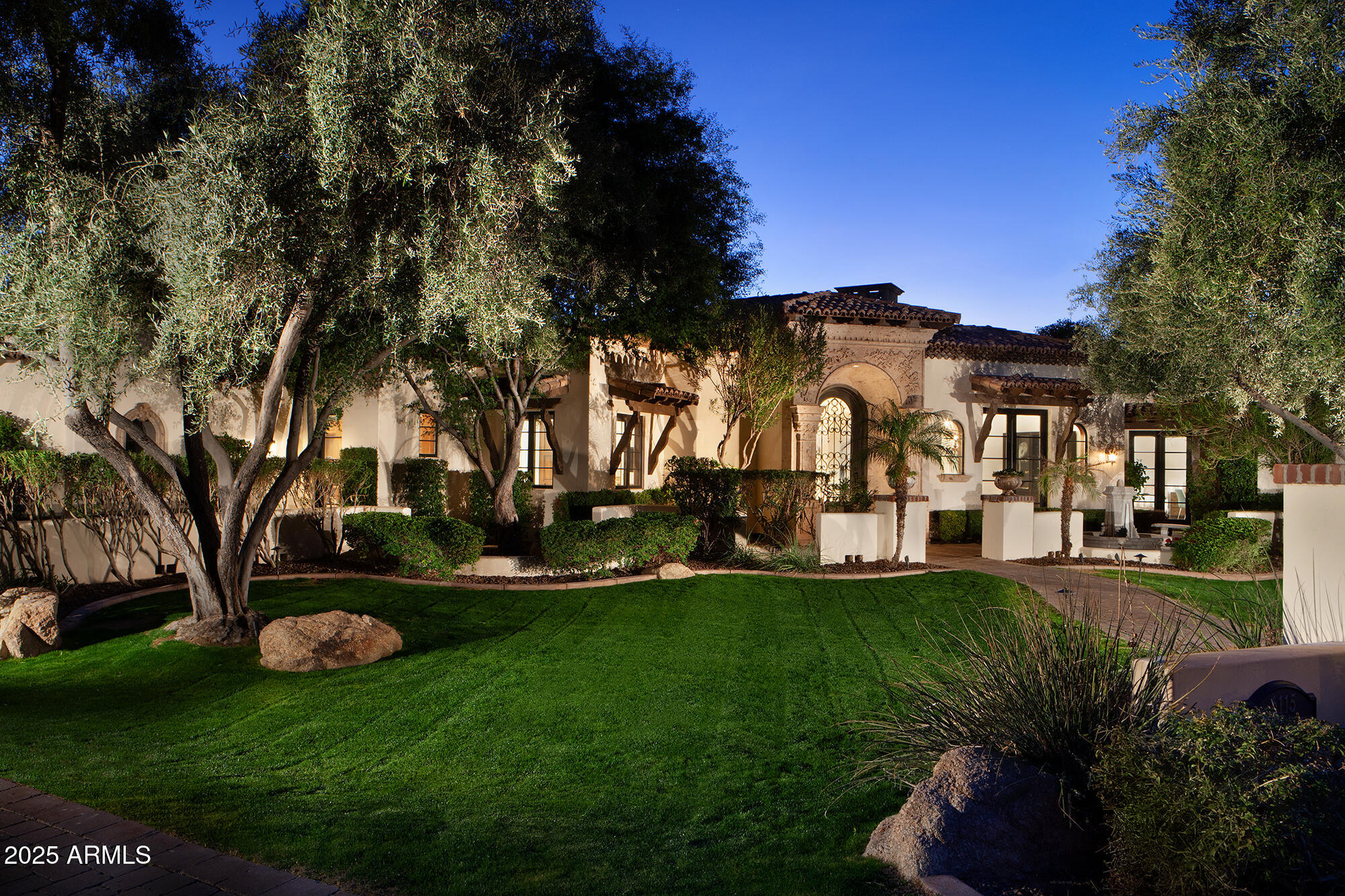 This spectacular home sits on a quiet cul-de-sac in one of Arcadia's best neighborhoods. Built by award winning Santorini Homes as his personal residence. It is loaded with the finest finishes and features  including alder wood finishes, Cantera stone, center island kitchen with high end appliances, a 14ft coffered ceiling, wine room and home automation. The Master Bedroom features an attached exercise/flex room and the spa-like bath with dual water closets and dual walk-in closets. There are 4 bedrooms and office (or 5th bedroom), 5.5 baths kitchen, living dining and family room all on one level. The fully finished basement has great natural light and features a Theater, Billiard Room, Gym, Powder Room, and access to the stunning backyard that includes pool, spa and fireplace.