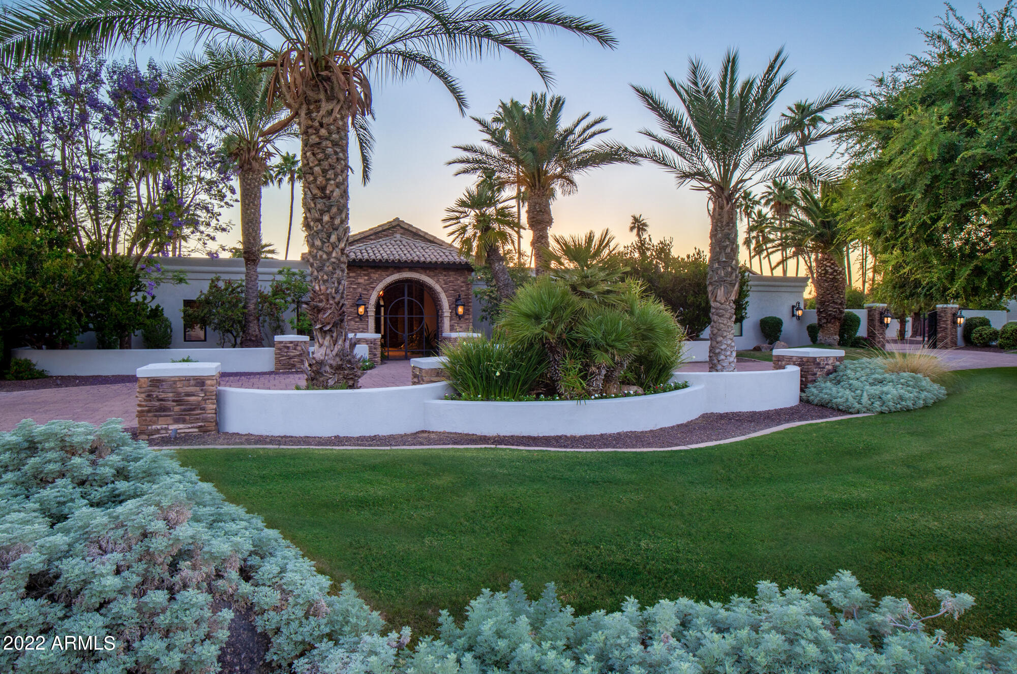 Exceptional home in coveted McCormick Ranch -adjacent to PV farms. Beautifully maintained and appointed throughout. REBUILT in 2006  with 2022 updates , check out the high quality finishes including cultured stone accents ,granite & marble, custom leaded glass/steel front door, dramatic living room overlooking the stunning backyard, Kitchen with Viking gas stove, sub zero refrigerator, slab countertops, high end cabinetry, breakfast area & wine bar, 4 bedrooms including 2 primary suites-main primary suite wi/ large sitting area & luxurious bath & patio, entertaining paradise with resort like backyard with pebble tech pool , BBQ station, gorgeous landscaping and mountain views, Like to garden? There's a large organic garden, Gated auto court-4 car Garage  with tons of storage & new epoxy Split floor plan, Custom closet systems throughout, Pella doors & windows- circular drive with custom pavers- Conveniently located near  McCormick Ranch Golf Course and Scottsdale's finest dining, parks, schools & shopping -check out virtual tour & video