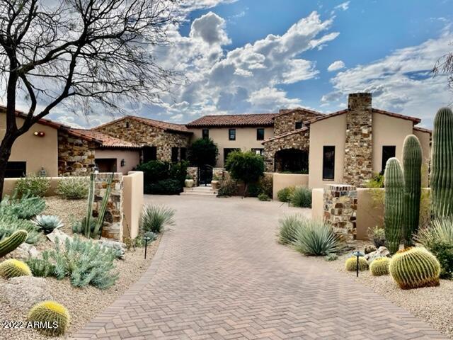 Stunning and Classic can describe this custom home. Traditional with a bit of contemporary and a hint of European all rolled into one gorgeous home. Details, LOCATION, MOUNTAINS, SUNSETS and Southern exposure. 3 bedroom en-suites,  Craft room w/closet exercise room, office/study, w/closet, 2 half baths, 32' lap pool, private Spa, Potting shed for gardening, 3.5 car garage and immaculate inside and out. THE FULL GOLF MEMBERSHIP to the Desert Mountain club can transfer for a pre approved applicant  at closing.No need to wait. Some Furnishings are available , separate bill of sale. Seller wants a longer close. May 6, 2022
