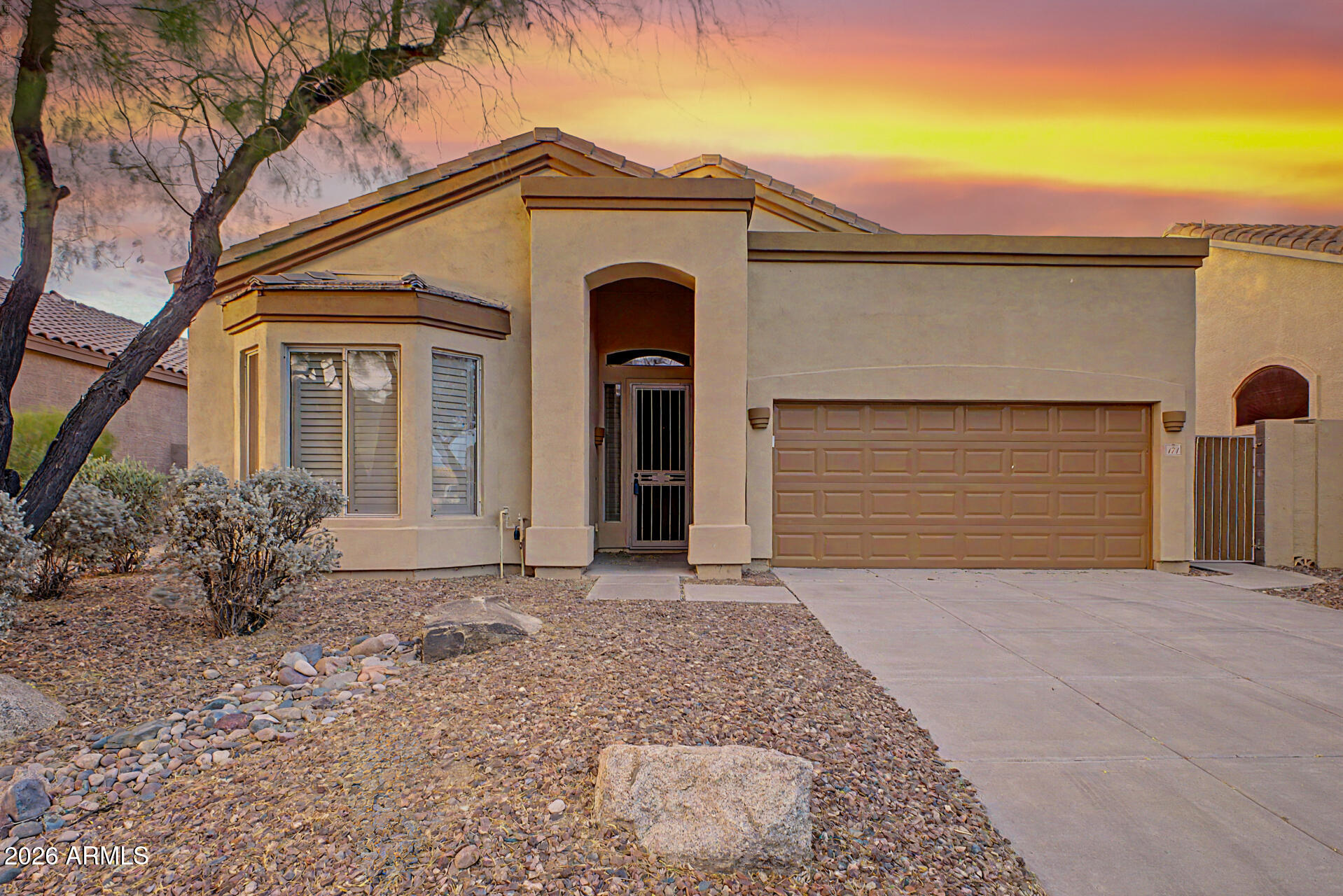 This beautiful single-level home has 3 bedrooms and 2 bathrooms, and sits in the award-winning, gated Las Sendas golf course community. It is close to a pool and spa, tennis and pickleball courts, a playground, and the elementary school. The home features vaulted ceilings, plantation shutters, and a split floor plan. The owner's suite has its own exit to the backyard and a spacious ensuite with a separate soaking tub and shower, double vanities, and a large walk-in closet. The other two bedrooms are roomy and private. The kitchen includes stainless steel appliances, a gas range, Corian countertops, and a family dining area. All appliances are included. Outside, you'll find a large covered patio, mature landscaping, and easy-care turf. The backyard opens to a private wash. This home is in a great spot for dining, travel, shopping, top-rated schools, and many other amenities.