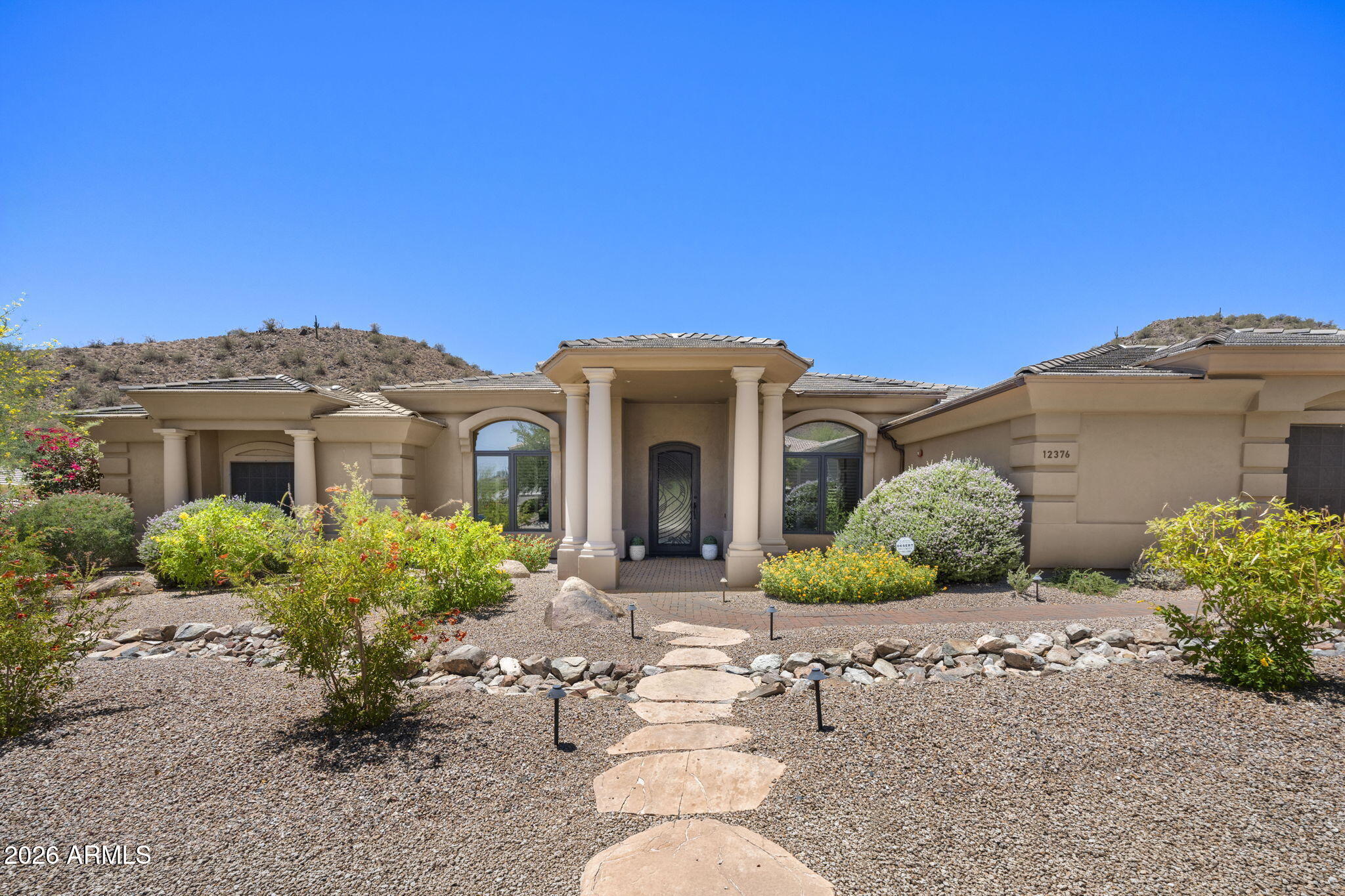 This is a rare find at this price in Scottsdale Mountain.  Single level no stairs with an exceptional private lot. Incredible negative edge pool deck and hot tub framed in a perfect mountain backdrop.  Enjoy peaceful evenings watching wildlife, the desert landscape and painted skies.  Huge master retreat, formal living, dining, and office.  This floor plan is perfect for both entertaining and family visitors.  Front formal has lovely multi slide doors which frame the mountain views the moment you walk in the front door. Massive paver driveway and 3 car garage offers tons of parking.  Heated spa, lovely BBQ and endless under roof outdoor patio space make this an incredibly enjoyable and livable property!