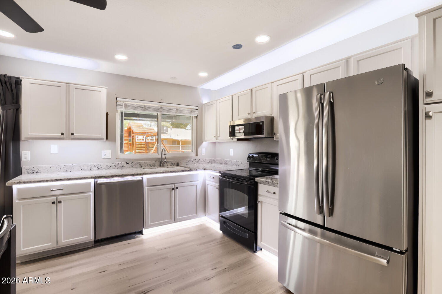 Rare opportunity to own a smart-home equipped 4-bedroom, 2-bath home with NO HOA, RV parking, and an oversized lot! This move-in ready property features a NEW roof, quality wood laminate flooring, recessed lighting, granite countertops, and a fully integrated whole-home entertainment system with interior and exterior audio/video security. The open-concept layout is ideal for everyday living and entertaining. Enjoy outdoor living with a pergola, powered patio sunshades, playset, and dedicated dog run. Additional highlights include permanent programmable exterior lighting, RV parking with double-gate access, 20-amp and 50-amp RV/EV hookups, extended covered parking, a partially insulated workshop/shed, fresh touch-up paint, and plenty of room to live, work, and play.
