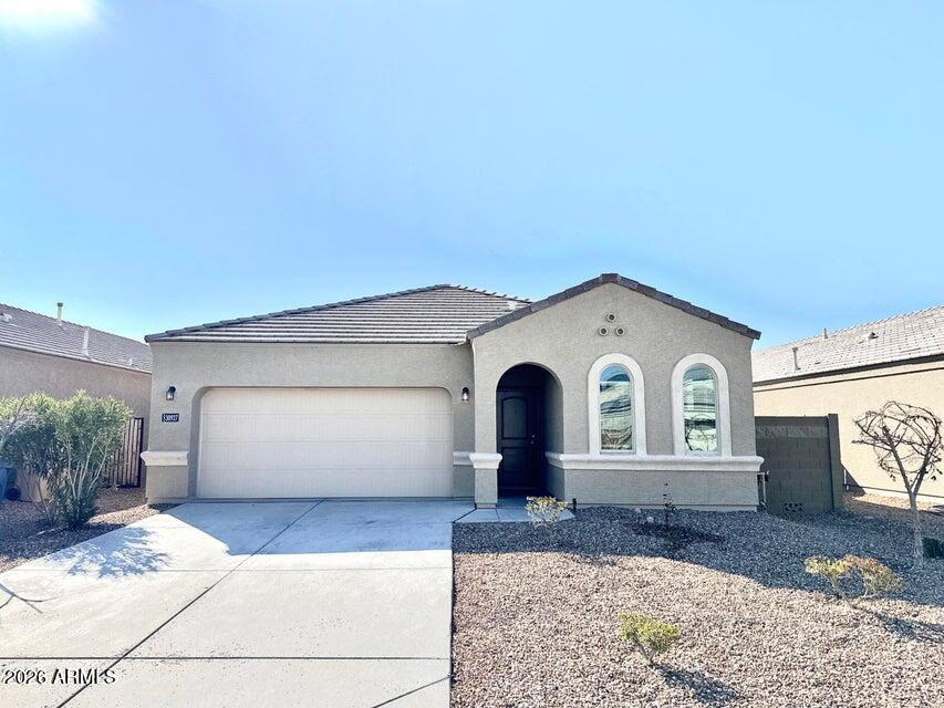 Take a look at this beautiful single story home located within the highly desired Tartesso community in Buckeye AZ 85396. This stunning home features 3 spacious bedrooms, 2 bathrooms, and a wonderful open floor-plan and a 3 car garage! Making your way through the home you have neutral colors throughout, tile flooring in the main living areas, along with a beautiful open kitchen with granite countertops, stainless steel appliances, and plenty of beautiful dark cabinets. Stepping into the spacious master suite you have double sinks and large walk in closet! The back yard provides a beautiful covered patio and easy to maintain landscaping.