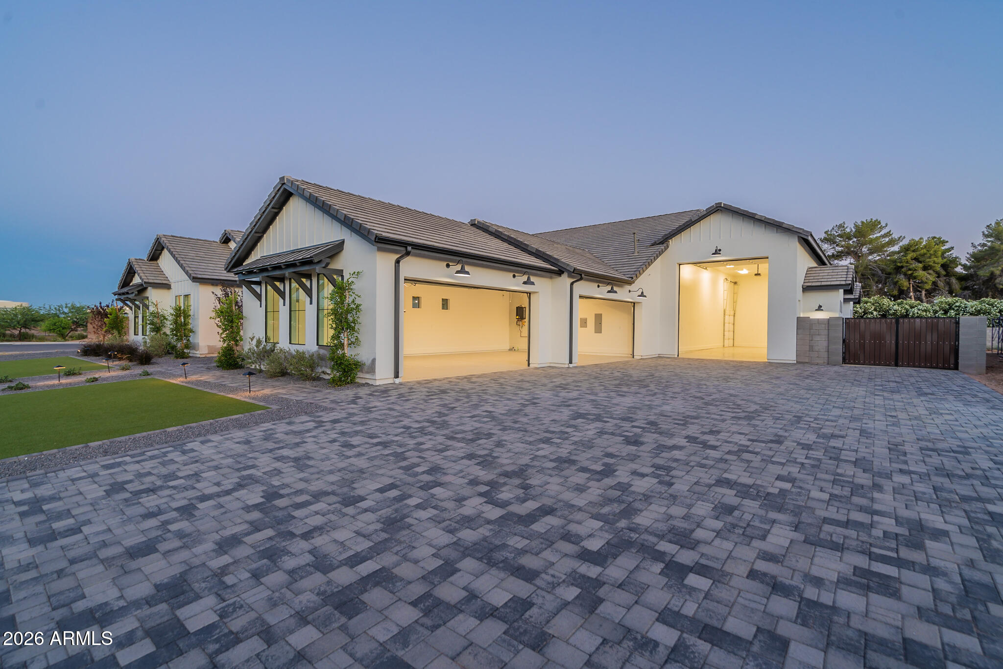 This 2022 custom estate in gated Avalon delivers rare flexibility with a truly expansive multi-generational layout that includes 2 full guest houses, 3 full kitchens, an air-conditioned RV garage and a resort style backyard built for year-round Arizona living.
The main home feels open and refined with soaring 14-foot ceilings in the great room, master suite and pantry, while a massive 20 by 9 triple slider frames the backyard and brings the outdoor living space into full view. The backyard includes a pool, 8-person spa, custom pickleball court, artificial turf, exterior lighting, surround sound and a 1,100 sq ft custom wraparound Alumawood patio designed for shade, entertaining and unforgettable celebrations. 
See additional comments... The chef's kitchen is a true showpiece with a 48-inch Wolf gas range, double dishwashers, wet bar, custom Solid Oak cabinetry in the entire home, under cabinet lighting, 3cm granite and quartz and a massive pantry with custom shelving 14' ceilings and a rolling library style ladder. 

Every bedroom is ensuite with walk-in closets and blackout window treatments, while the home also includes an office, den, great room, real wood beams, solid wood 8-foot doors, upgraded fixtures, smart locks and luxury finishes throughout.

Car lovers, collectors and hobbyists get an extended 4 car garage with overhead storage plus a fully insulated and air conditioned RV garage, movie projector, surround sound, gym or shop potential, 16 foot ceilings, all garages have epoxy floors, RV dump, shop sink, 220V outlets in both garages, two workshop niches and an extra garage door to the backyard for entertaining flow PLUS TWO RV gates for any extra toys/storage needs.

Efficiency was built in from day one with full spray foam insulation in all walls and ceilings, insulated garage doors, Milgard windows and custom sliders, all Trane AC units, a commercial grade Rinnai tankless water heater, whole house water filter, double layered roof underlayment and thoughtful garage placement on the west side to help protect the living spaces from heat. This means 5,089 sq/ft with a $350 avg electric bill.

Both guest houses include full kitchens, living spaces, appliances, bedrooms and ensuite baths. The pool house opens directly to the backyard with sliders, its own surround sound and direct access to the RV garage, while the front casita connects near the garage with a private entrance and creates ideal space for long term guests, extended family, workspace or rental option.

Avalon is a quiet, secluded, and luxury gated 14 lot custom home community on a single oversized cul de sac where every lot is half acre or larger. The rear of the property backs to 1 acre residential lots for added privacy, while the location allows you to walk to Tumbleweed Park or access Paseo Trail directly from the neighborhood. With north south exposure, privacy on all sides and an upgrade list that makes one thing clear, this home was built to live in, not built to sell. To build would be 3 mil+ or you'd have to go to Queen Creek.