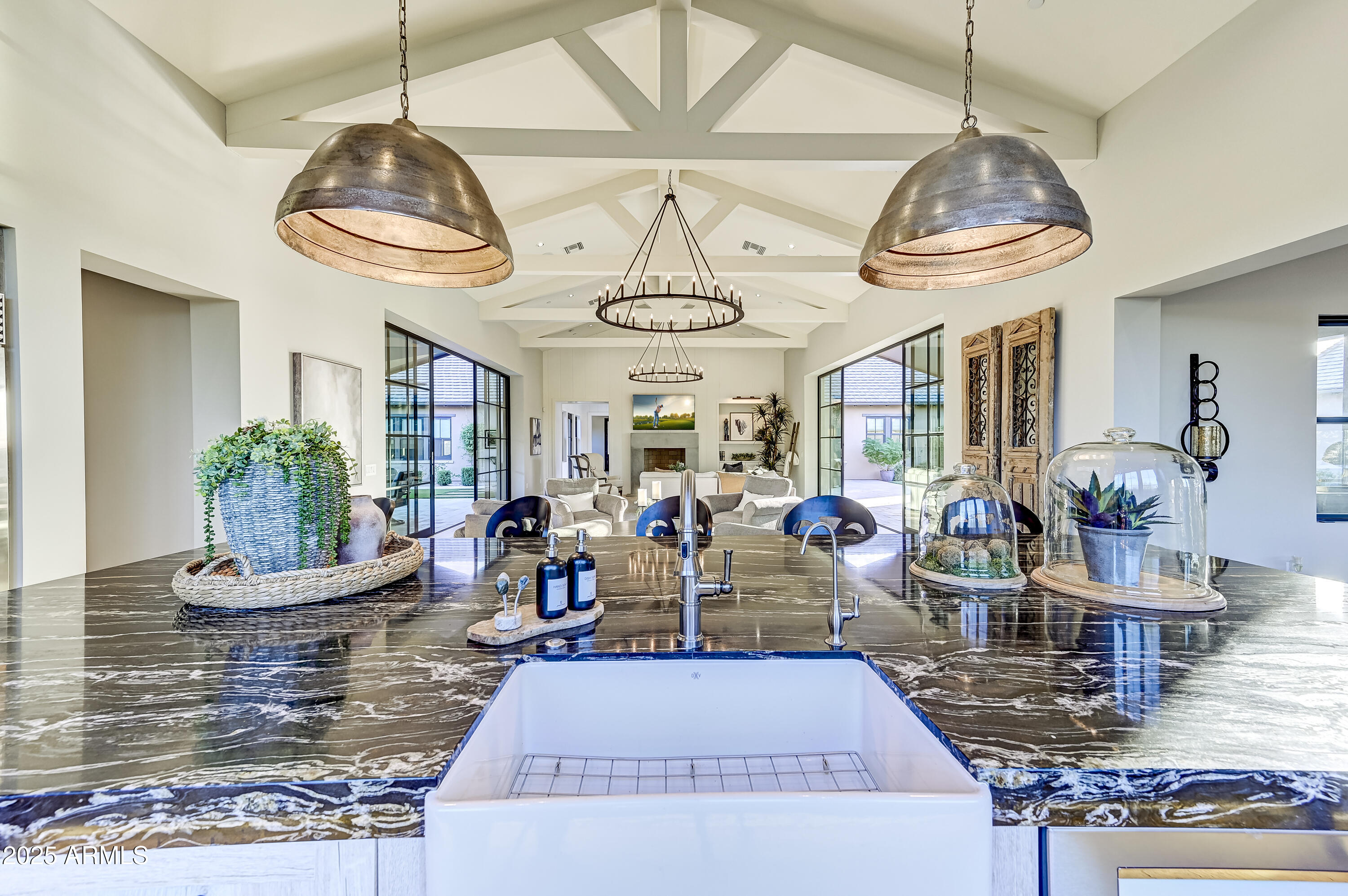 Welcome to the stunning Cheval model by Camelot Homes in Bronco Estates, offering a generous 6,240 sq ft of living space (including a 869 sq ft self-sufficient casita), perfect for guests or multigenerational living. Every detail of this smart home (Control 4) showcases timeless elegance, from the rich wood flooring throughout to the beautifully updated kitchen featuring top-of-the-line appliances and a striking spacious island.

The luxurious primary suite is thoughtfully positioned at the rear of the property, offering privacy and easy access to the serene spa and outdoor patio area. The main house also boasts three additional ensuite bedrooms, while the detached casita by the pool and expansive patio offers a fifth bedroom—ideal for hosting family gatherings or entertaining. Extra parking and privacy!  The climate-controlled four-car garage provides ample space for both vehicles and storage, ensuring practicality without sacrificing style and providing an EV outlet for convenience. 

Located in a highly sought-after area, this home is just minutes from top-tier shopping, dining, and recreational opportunities such as golf and a variety of hiking trails for all skill levels.

This is an exceptional opportunity to own a beautifully crafted home from one of the Valley's most respected builders at an attractive price. Don't miss your chance to make this dream home your own!