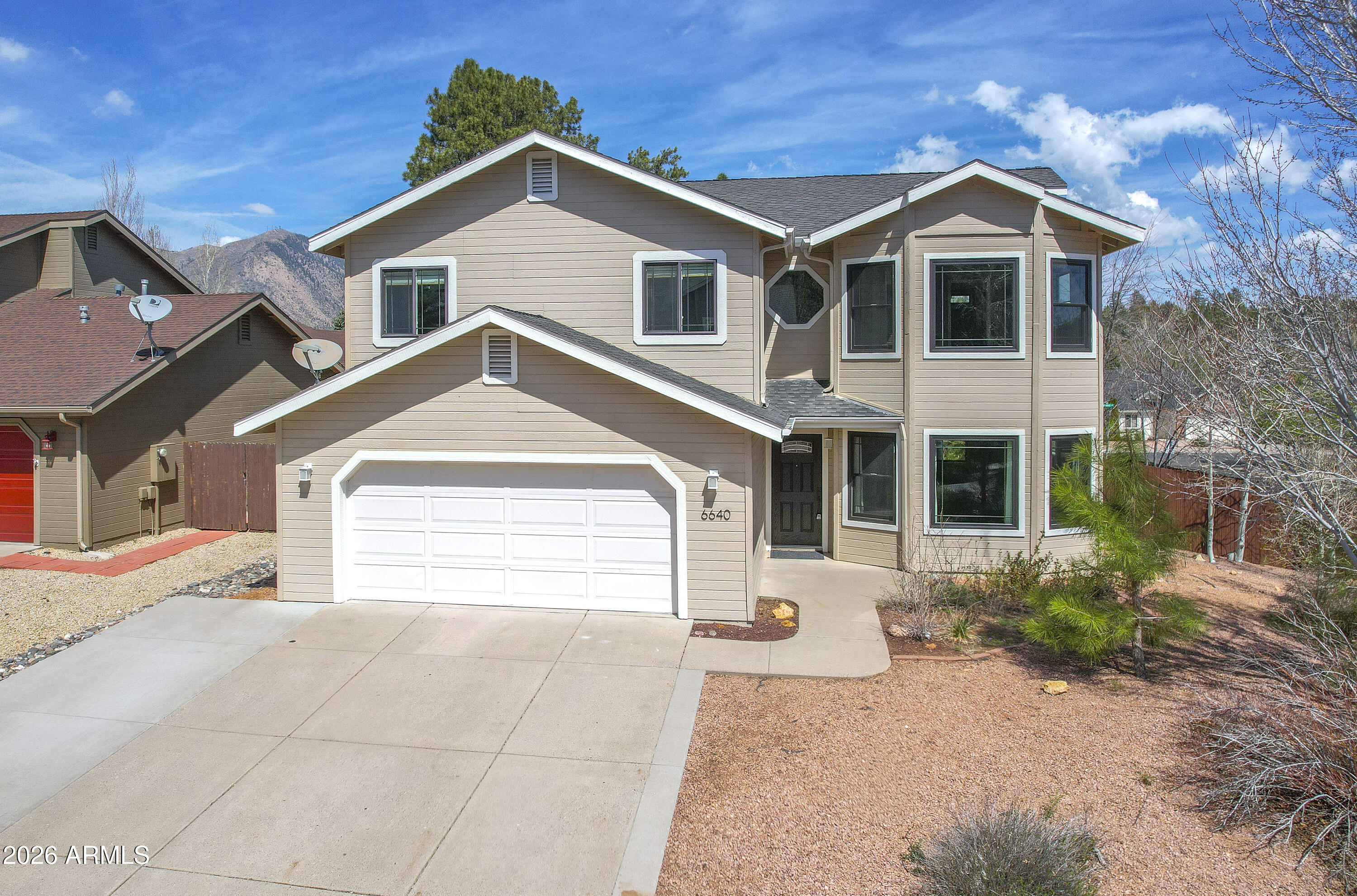 Tucked into a quiet corner of Walnut Meadows, this four-bedroom home sits on a generous quarter-acre usable lot. Inside, you'll find formal living and dining areas, along with a family room centered around a cozy gas fireplace. All four spacious bedrooms are located upstairs, creating a comfortable and functional retreat. Bay windows fill the home with an abundance of natural light, giving it a bright and welcoming feel. With air conditioning, upgraded windows, a south-facing driveway, and an expansive covered back porch, it's easy to enjoy this home year-round. Step outside to relax, garden, or shoot hoops on your own backyard basketball court. Lovingly cared for over the years, this home is ready for its next chapter.