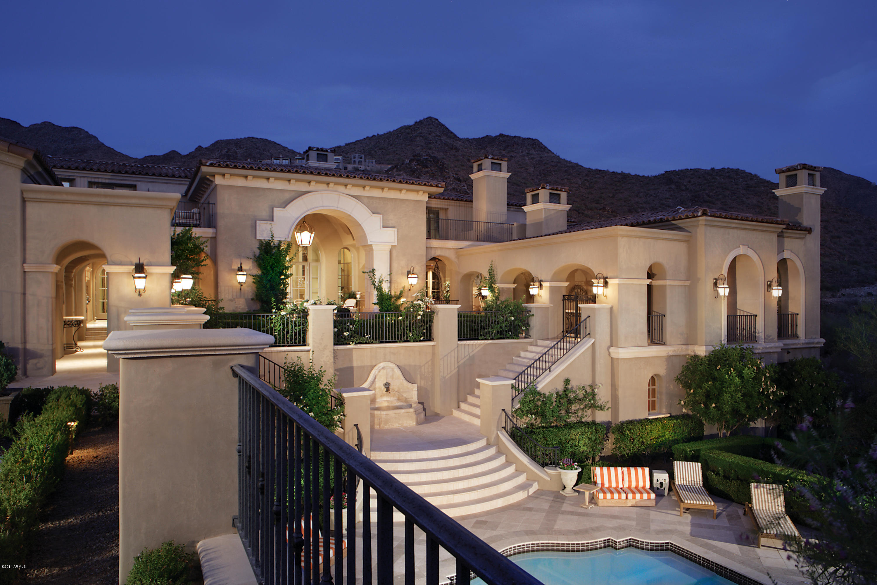 This majestic 2 acre estate is situated in the upper canyon Silverleaf with city light and mountain views abounding from nearly every room. The 14,313 s.f. home encompasses 5 bedrooms, 8 bathrooms and a guest casita. You enter into a grand entry hall alongside a romantic staircase. This opens up to a posh living area adjacent to a luxurious wet bar with zinc counters all overlooking the covered patio and spectacular city light views. To the right is a formal dining room with limestone fireplace. The gourmet kitchen showcases Clive Christian cabinetry imported from England, zinc counters and top of the line appliances. The exquisite master suite includes a lavish bath, exercise room and sauna. The magnificent 2,000+ square foot office has reclaimed wood flooring from a French castle. Much..