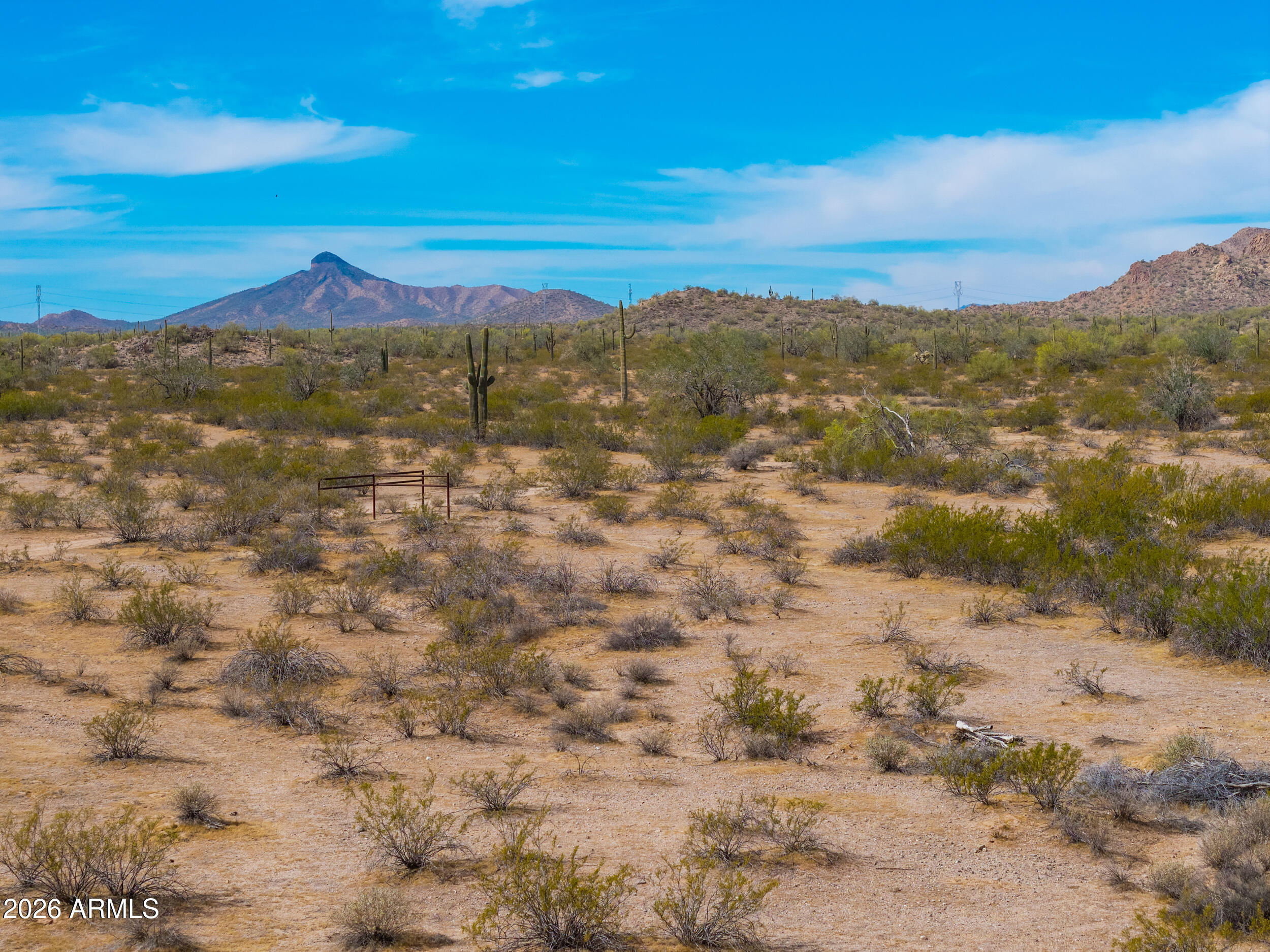 Discover the wide-open beauty of rural Arizona with this 5-acre parcel in Casa Grande offering stunning desert and mountain views in every direction. Surrounded by natural Sonoran landscape, mature saguaros, and peaceful desert terrain, this property provides the perfect setting for your custom home, manufactured home, or long-term investment. Enjoy the privacy and tranquility of rural zoning while still being within a reasonable distance to Casa Grande amenities, I-10 access, and continued area growth. The property features mostly level ground with natural desert washes, making it ideal for a variety of uses while maintaining the character of the land. Whether you're looking to build now or hold for the future, this property offers flexibility, views, and value
