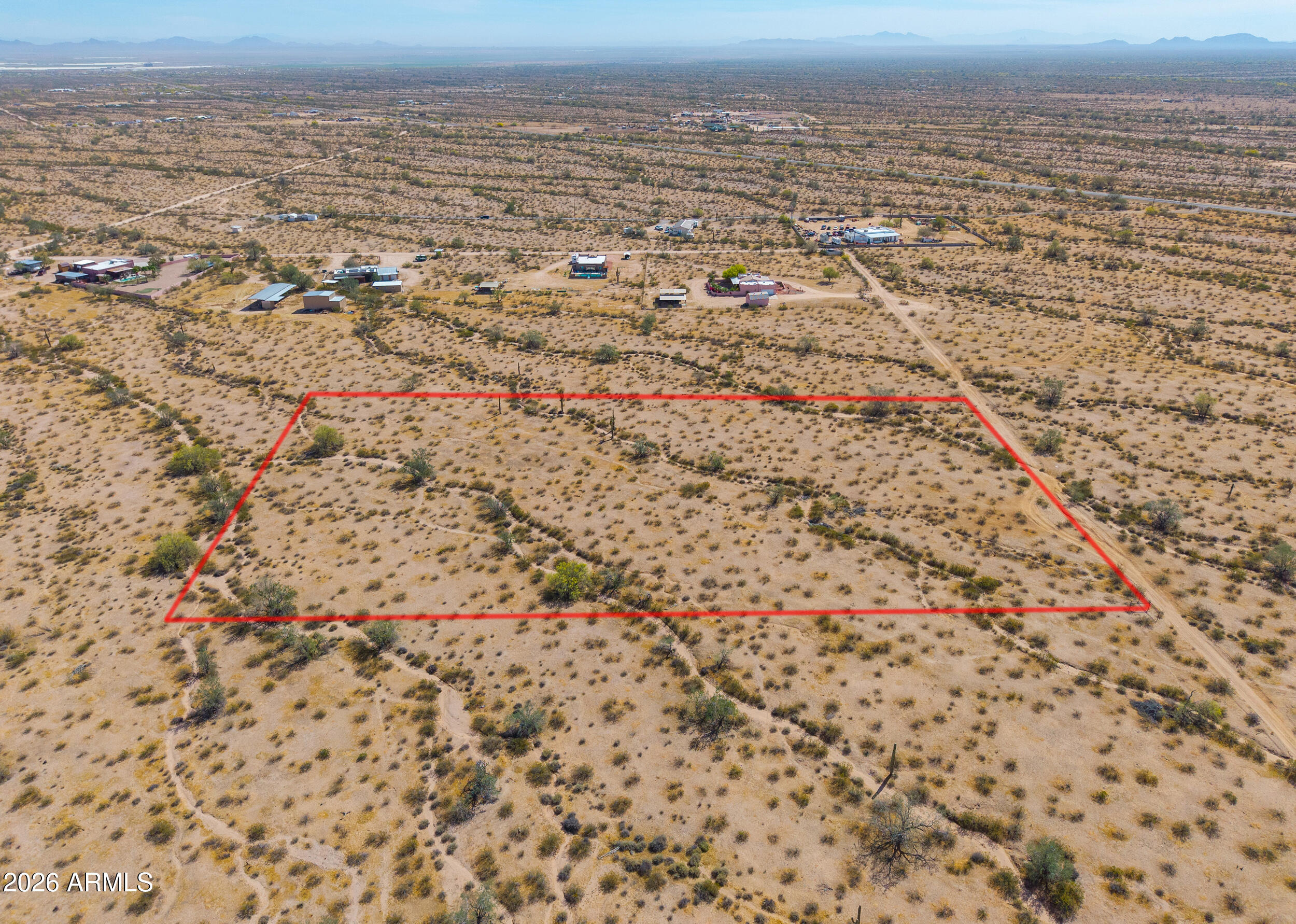 Discover the wide-open beauty of rural Arizona with this 5-acre parcel in Casa Grande offering stunning desert and mountain views in every direction. Surrounded by natural Sonoran landscape, mature saguaros, and peaceful desert terrain, this property provides the perfect setting for your custom home, manufactured home, or long-term investment. Enjoy the privacy and tranquility of rural zoning while still being within a reasonable distance to Casa Grande amenities, I-10 access, and continued area growth. The property features mostly level ground with natural desert washes, making it ideal for a variety of uses while maintaining the character of the land. Whether you're looking to build now or hold for the future, this property offers flexibility, views, and value
