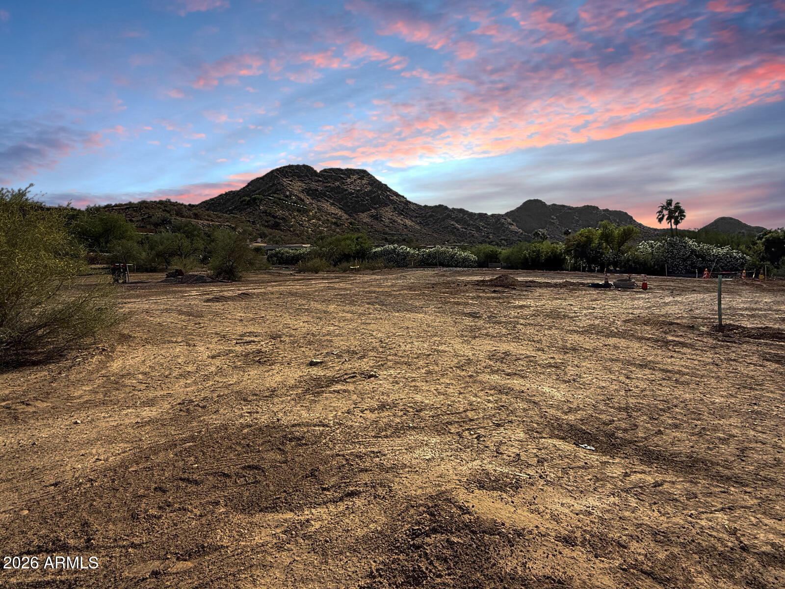 Located at the base of iconic Mummy Mountain, Lot 12 at 6107 E. Ironwood Drive offers a rare opportunity to acquire one of the final homesites in Silver Sky, Paradise Valley's newest ultra-luxury enclave. This private, nearly 1.3-acre estate parcel is one of just twelve custom homesites, thoughtfully positioned to capture expansive desert scenery and mountain views. Silver Sky provides exceptional flexibility for discerning buyers, with the option to select from fully designed, award-winning architectural plans or collaborate with a preferred team to create a truly bespoke residence. With only two parcels remaining and the first luxury estates scheduled for release in 2026, opportunities within this exclusive community are increasingly limited. Defined by generous lot dimensions, exceptional privacy, and proximity to Arizona's world-class dining, resorts, golf, and retail, this offering presents the ideal foundation for a contemporary desert retreat or a timeless estate. Secure your place in Paradise Valley's most sought-after new luxury neighborhood and begin building a legacy property in Silver Sky.