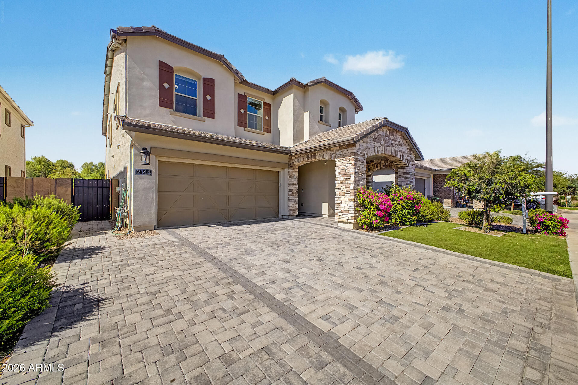 Welcome to an exceptional residence in the highly sought-after STRATFORD community of Gilbert, where modern luxury meets effortless living. Built in 2022 by Blandford Homes, 2144 E Flamingo Way offers approximately 3,000 sq ft of refined design, featuring 5 bedrooms, 4.5 bathrooms, a versatile den/bonus room, and a spacious 3-car tandem garage. The home showcases elevated finishes, expansive living spaces, and a seamless flow between the kitchen, dining, and great room--perfect for both sophisticated entertaining and comfortable everyday living. A rare and highly desirable feature is the secondary master bedroom located downstairs, offering ideal flexibility for multi-generational, The chef-inspired kitchen connects beautifully to the main living area, creating a central gathering space filled with natural light and modern appeal. Upstairs and additional bedrooms are generously sized, each thoughtfully designed for privacy and comfort.
The primary suite serves as a private retreat, featuring with tub and shower and a calming atmosphere designed for rest and relaxation. Step outside to a low-maintenance backyard with turf, designed for effortless Arizona living--beautifully finished, functional, and perfect for outdoor enjoyment without the upkeep.
Located in one of Gilbert's premier neighborhoods, this home offers close proximity to top-rated schools, SanTan Village shopping and dining, parks, and convenient access to Loop 202 and US-60.
A rare opportunity to own a nearly new luxury home in STRATFORD with this price, blending modern architecture, thoughtful design, and premium livability in one of the East Valley's most desirable communities.