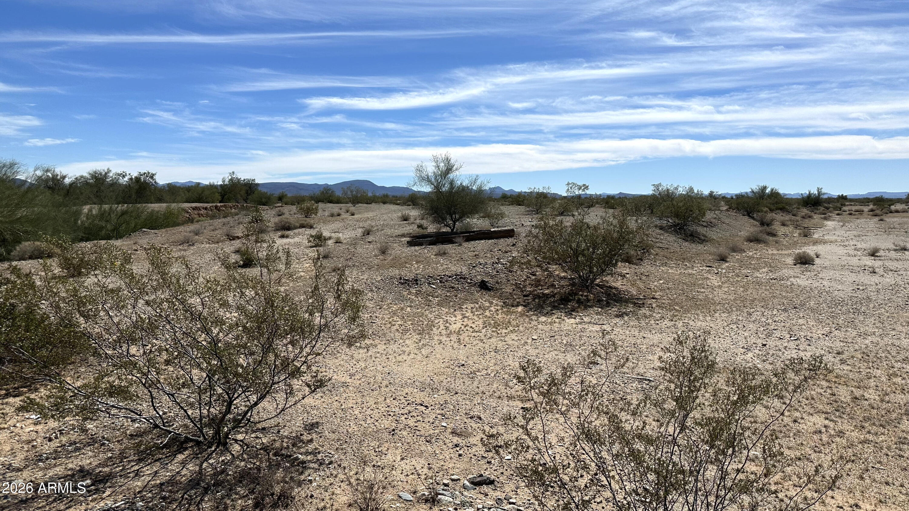 This 5 acre lot has been surveyed and professionally lot split into 4 parcels- Parcel 1: 2 acres, Parcel 2: 1 acre, Parcel 3: 1 acre, Parcel 4: 1 acre. Located on a county island surrounded by the Town of Gila Bend, County of Maricopa, Bureau of Land Management and the Barry M. Goldwater Range, this property offers some of Arizona's best untouched scenic and wildlife views around. With the availability of solar electric and the numerous established water wells in the area, remote off-grid living can be a reality year round or seasonably. Access to and from the property is easily accessible with 2 or 4 wheel drive vehicles. Buyer to verify all facts, figures and measurements.