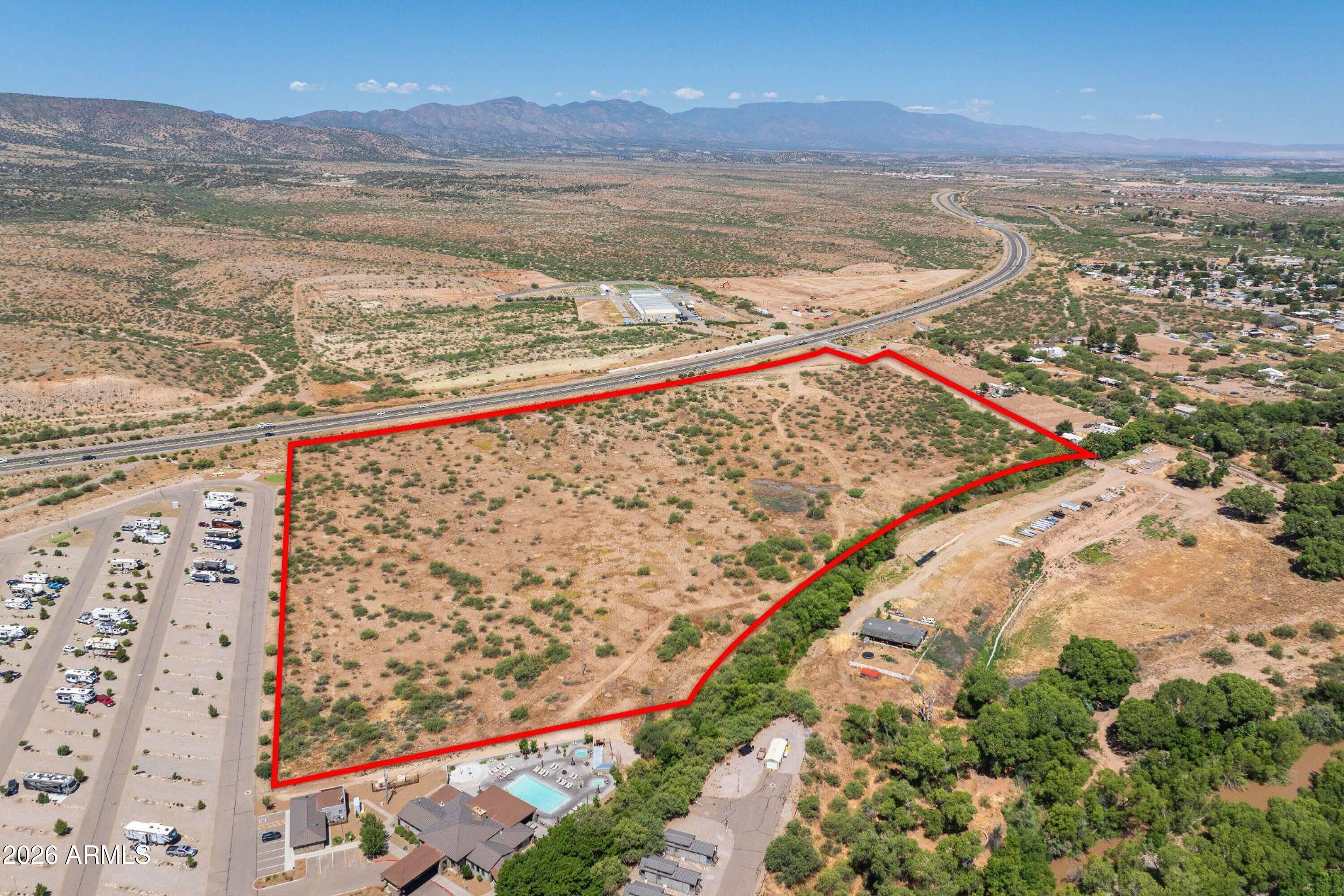 Rare, fully subdivided development opportunity featuring 119 high-density residential lots plus 4 commercial lots totaling ±1.87 acres of SR-260 frontage. Strategically located near the I-17 interchange, offering exceptional visibility, direct freeway access, and proximity to Phoenix, Flagstaff, Prescott, Sedona, and the Verde Valley. Traffic counts include approximately 55,000 vehicles per day on I-17 at Exit 287 and 13,000 vehicles per day on SR-260. Located within Census Tract 16.01, a Qualified Opportunity Zone offering potential tax advantages for qualified investors. Additional benefits include no Camp Verde sales tax, food tax, or impact fees.