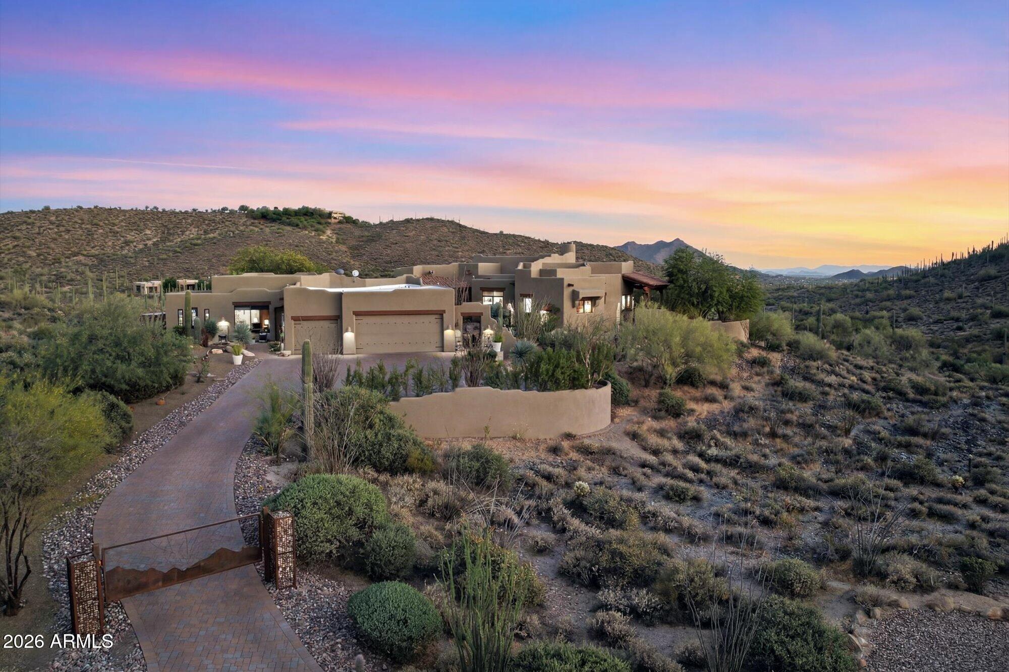 Experience true Arizona living in this impeccably renovated Southwestern-Hacienda retreat located in the desirable scenic Cottonwood Canyon / Sierra Vista desert corridor. Situated to capture sweeping valley views for miles, this home showcases one of the most thoughtful and high-quality transformations on the market today.
Extensively updated throughout, the home features stunning new flooring, a completely reimagined chef's kitchen, beautifully redesigned fireplace, and exceptional indoor-outdoor living spaces with professionally crafted front and rear hardscapes. Every detail has been carefully curated, blending authentic Southwest character with elevated modern finishes and timeless design. The open floor plan flows effortlessly for both entertaining and everyday living, while expansive windows frame breathtaking desert and mountain views from multiple vantage points throughout the home.
The outdoor spaces are equally impressive, offering privacy, tranquility, and unforgettable sunsets in a setting that truly embraces the Cave Creek lifestyle.
This is easily one of the cleanest, most well-executed homes to hit the market--an exceptional opportunity for buyers seeking quality, style, and unforgettable Arizona views.The furniture in this home may be available.