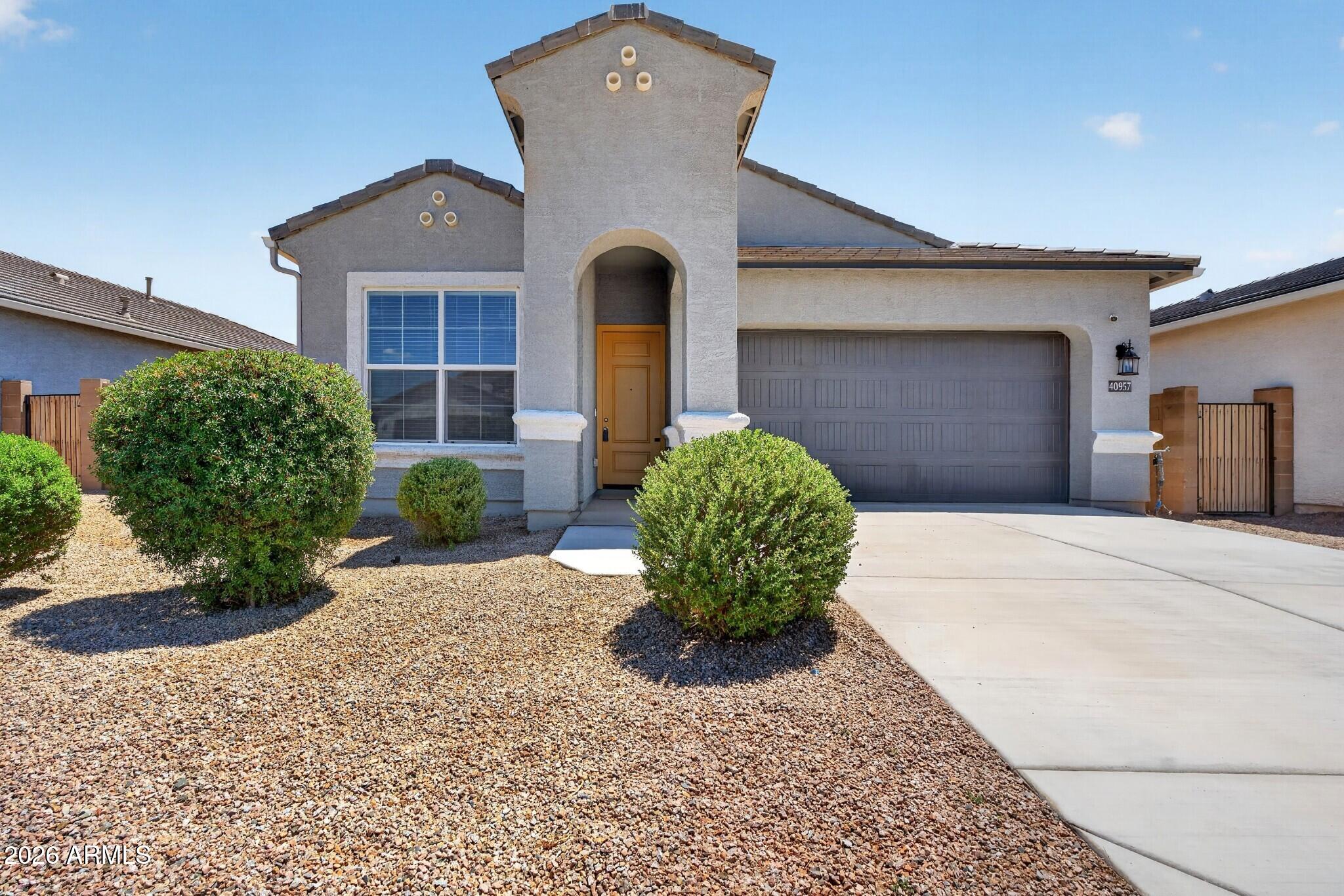 This single story 3 bedroom 2 bath home was built in 2022 and has just been redone with brand new interior paint, new carpet and ceiling fans throughout. The main areas feature tile which flows into the open concept kitchen with quartz counters, breakfast island, white cabinets and walk-in pantry.  The bedrooms have new carpet with a split floorplan. primary has en-suite with dual sinks, oversized walk-in shower and large walk-in closet. The backyard has covered patio, rock and is ready for your design. The Lakes neighborhood is located on the north side of Maricopa for quicker access to Chandler and has a lake entrance, walking paths, numerous covered playgrounds and city ballpark.