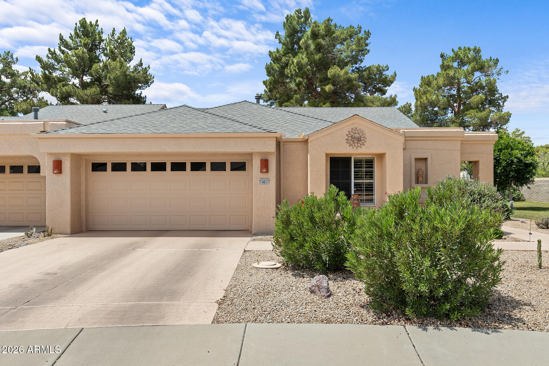 One of the most meticulously maintained Gemini/twin homes you will find in Sun City West. Ideally positioned at the end of a quiet cul-de-sac, this home borders a lush HOA-maintained greenbelt with mature trees and beautiful grass views, creating a private and peaceful setting that is hard to find. Enjoy the covered patio/pergola area overlooking the greenbelt, along with a bright and inviting interior filled with natural light. The updated kitchen features white upper cabinetry, contrasting lower cabinetry, updated counters, backsplash, recessed lighting, plantation shutters, updated faucet, and a clean, timeless feel. The living area offers vaulted ceilings, hardwood flooring, updated ceiling fan, and large windows that bring in great natural light. Seller reports approximately $80k + in recent updates and improvements, including hardwood flooring, kitchen remodel, updated appliances, HVAC/furnace, insulation, remodeled shower, closet systems, interior and garage paint, front entry door, exterior lighting, ceiling fans, kitchen hardware, updated faucet, and door hardware. Plus, the home has leased solar panels for energy efficiency and savings! A beautifully cared-for home with meaningful updates already completed and a rare private greenbelt setting.