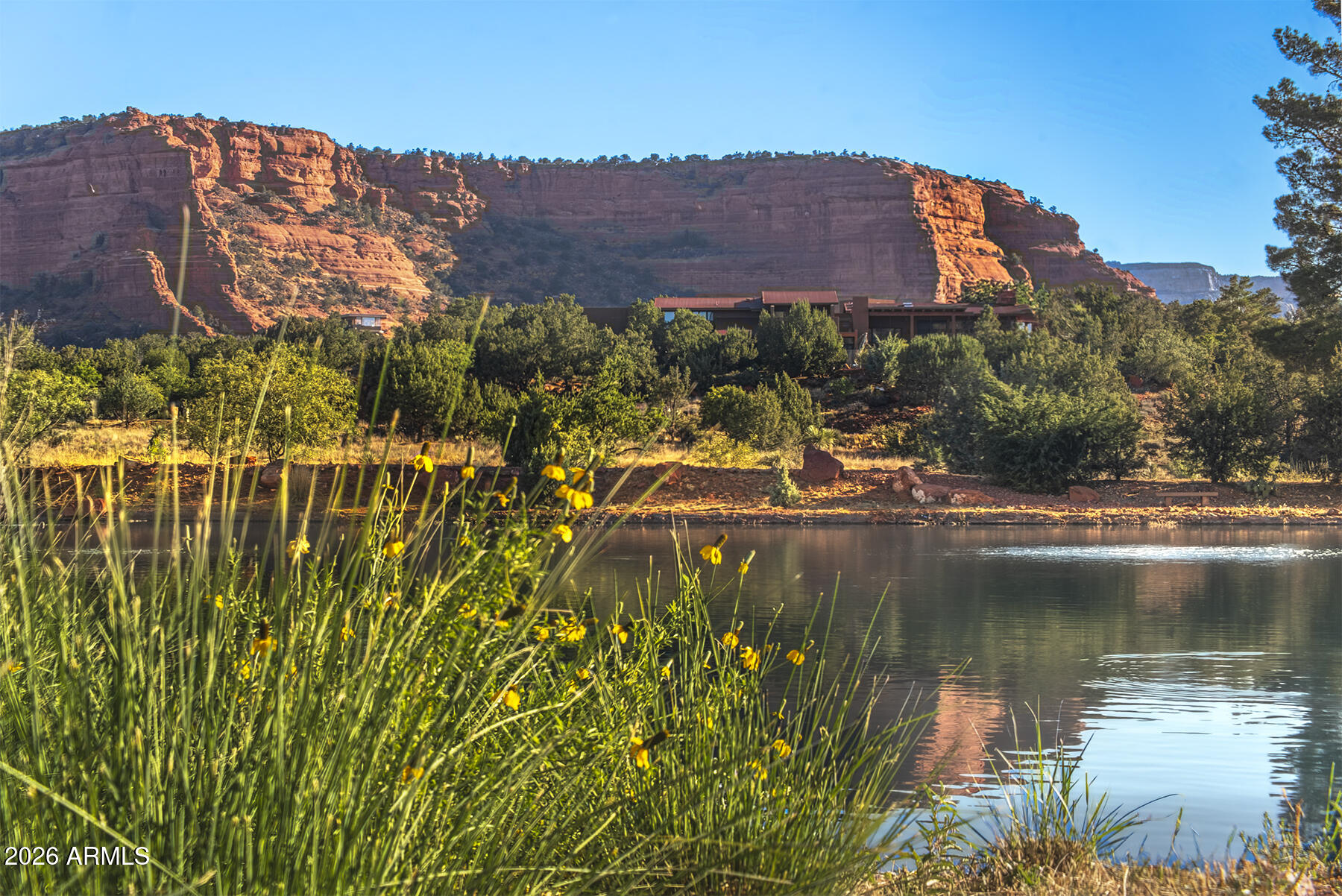 Build your dream retreat in Sedona's Premier Luxury Gated Community of The Aerie! Located within the heart of the stunning Coconino National Forest, this lake front estate sized parcel of 2.02 acres enjoys panoramic jaw dropping, sweeping Red Rock views of Doe and Cockscomb Mountains to the West and South, the Secret Mountain Wilderness to the North, and Chimney Rock, Thunder Mountain and Cathedral Rock on the Eastern skyline.  
The level to gentle sloping topography makes for an easy build. With a 31,835 SF building envelope, your canvas awaits.  It is more than land, it is an invitation to build a legacy in one of the most revered landscapes of America.  
An elaborate Forest Service trail system  surrounds The Aerie and a short scenic drive takes you to the famous Enchantment Resort and the renowned, private Seven Canyons Golf Resort, and Sedona's vibrant restaurants, art galleries, movie theatre and grocery stores.
Architectural plans for a 5,360 SF home by the prestigious Cosan Studio of Scottsdale are already approved by the HOA and could fast track your dream to living your Sedona Dream Lifestyle at The Aerie.  Cosan Studio house plans are not included purchase price, but may be acquired separately.