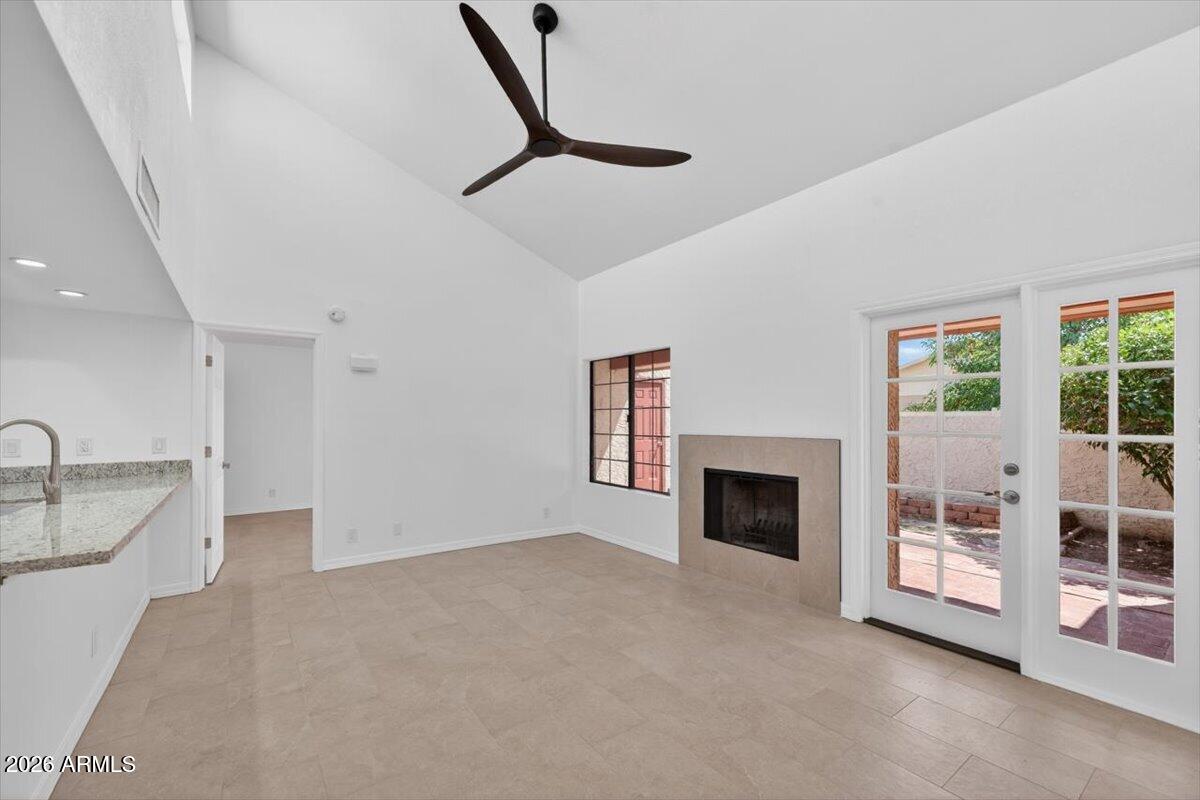 Huge price adjustment on an exceptionally stylish Tempe condo close to Arizona State University! Modern single-level split bedroom floor plan with vaulted ceilings, clerestory windows & open layout filled with natural light. Fully updated with premium tile flooring, glass enclosed walk in shower in primary bath, granite countertops, stainless appliances, satin nickel fixtures & designer finishes throughout. Spacious private backyard features covered patio, mature orange tree & extra storage room. Inside laundry/pantry, covered parking beside front door & outstanding functional layout. One of the most impressive condos in the area -- discover it & make it yours before it is gone. :)