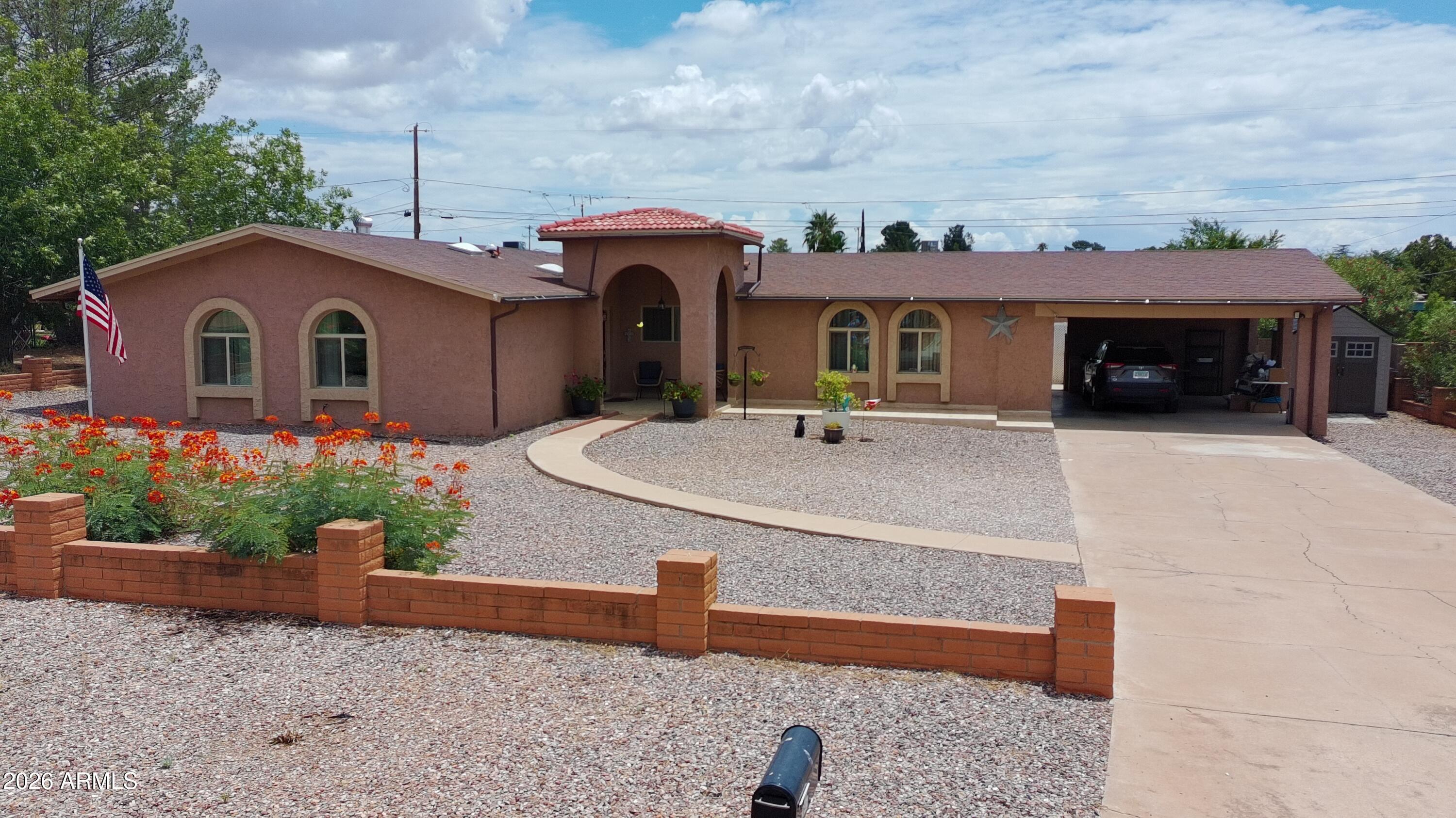 Space, comfort, and timeless Southwest charm come together in this beautifully maintained 4-bedroom, 2-bath home. Set on a landscaped, fully fenced lot, it welcomes you with outstanding curb appeal, a charming covered entry, and an expansive front yard. Inside, the versatile floor plan features a spacious living room, separate family room, formal dining room, and a cozy wood-burning fireplace. The private backyard offers an oversized covered patio, lush lawn, mature trees, and low-maintenance landscaping--perfect for entertaining or relaxing. Solar panels provide added energy efficiency, making this exceptional home one you won't want to miss!