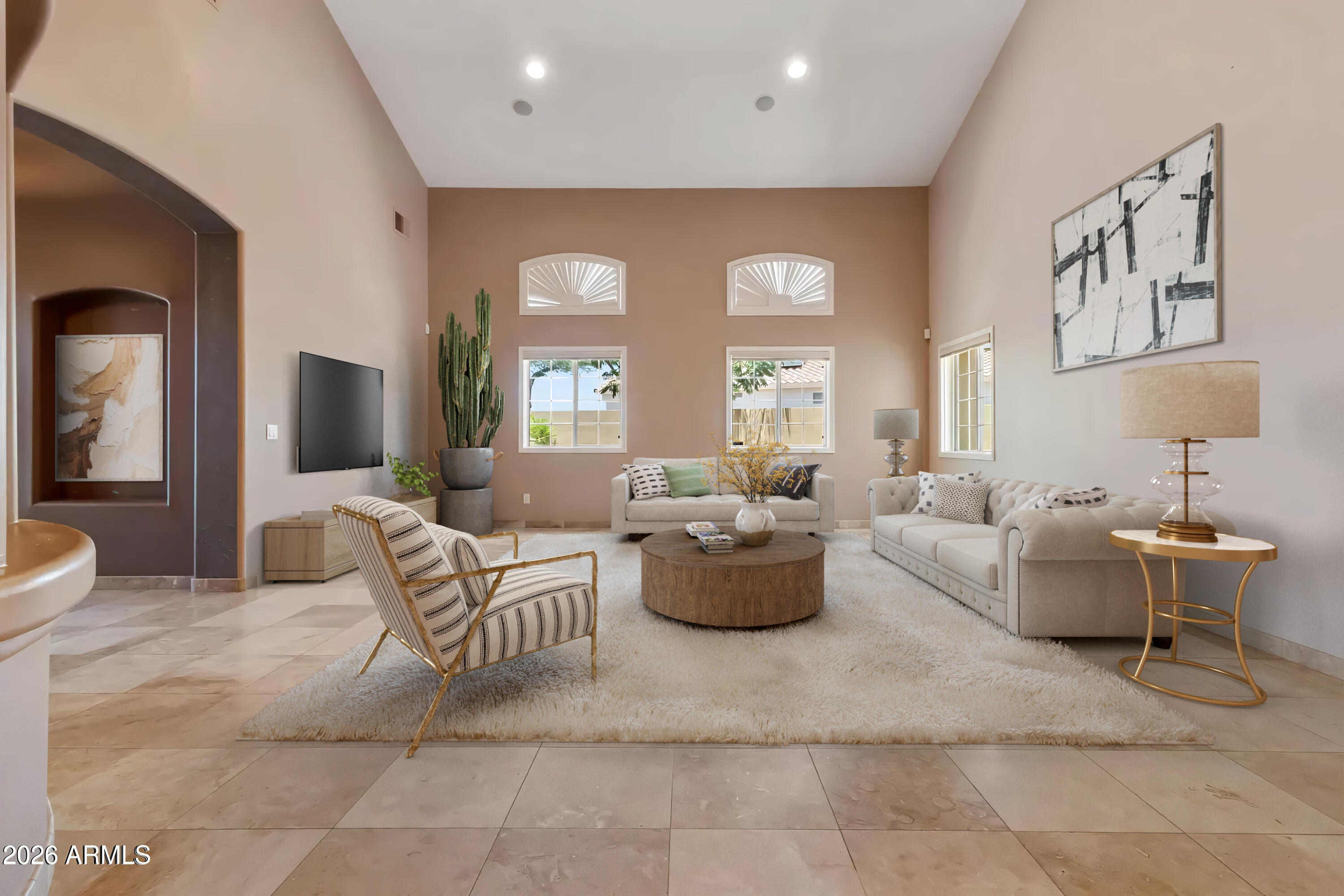 Experience luxury and space in this rare to market 3,646 sqft, single-story custom home located in a highly coveted Surprise location. Featuring a 5 bedroom/4 bathroom, split floorpan and breathtaking 20-foot gabled ceilings, this home backs up directly to Coyote Lakes Golf Course.  The gourmet kitchen and island is open to the family room ensuring  plenty of room for family and guests.  The spacious back yard boasts fruit trees, a covered patio, and a built in fire place and seating.  Come see for yourself and don't miss out on making this dream home yours!
