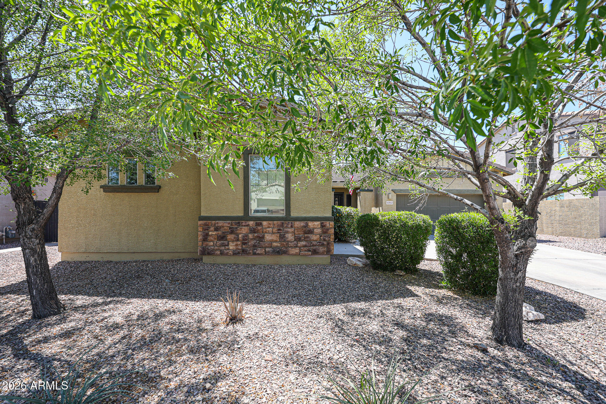 Nestled in the scenic desert landscape of New River, this beautifully maintained home at 42812 N 45th Drive offers the perfect blend of comfort, space, and Arizona charm. Situated on a generous lot with stunning mountain views and peaceful surroundings, this property delivers the privacy and tranquility buyers crave while remaining conveniently close to shopping, dining, and freeway access. Inside, you'll find an open and inviting floor plan filled with natural light, spacious living areas, and thoughtfully designed finishes throughout. The well-appointed kitchen flows seamlessly into the main living space, making it ideal for entertaining or everyday living. The expansive backyard provides endless possibilities for outdoor enjoyment, with your own private pool and artificial grass.