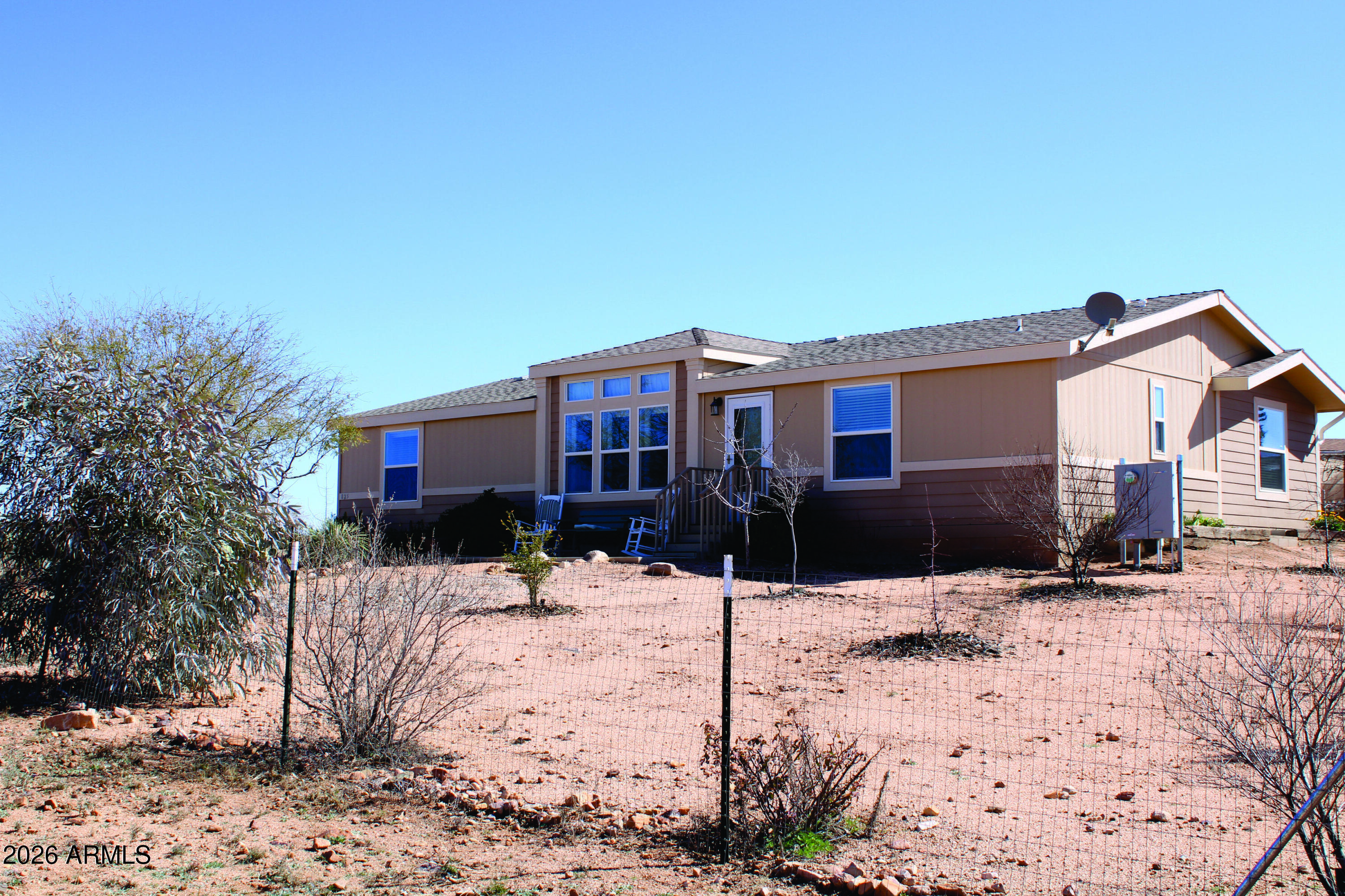 Come and enjoy life in the beautiful rolling hills of Benson. This incredible 1792 SQ Ft home with more storage than you can use, set with views of the area and beyond. Well, maintained 3 bedroom, two bath home with upgraded appliances, including washer and dryer. Large bedrooms, luxurious main bath with double sinks and breathtaking shower surround on 12.35 acres. 400 Amp electric box service. Garage with workshop, cabinets, shelves and work-table. Raise planters with Fruit and vegetable drip Irrigation systems. Trees and other plants around the property make this your relaxing forever home. Two sheds and carport. This Cochise County RU-4 zoned parcel is perfect for your horses or other animals. Close to Benson for your shopping needs. Close to all Cochise County historic Sites. Sale includes Parcel 124-04-004K and Parcel 124-04-004L Don't miss out