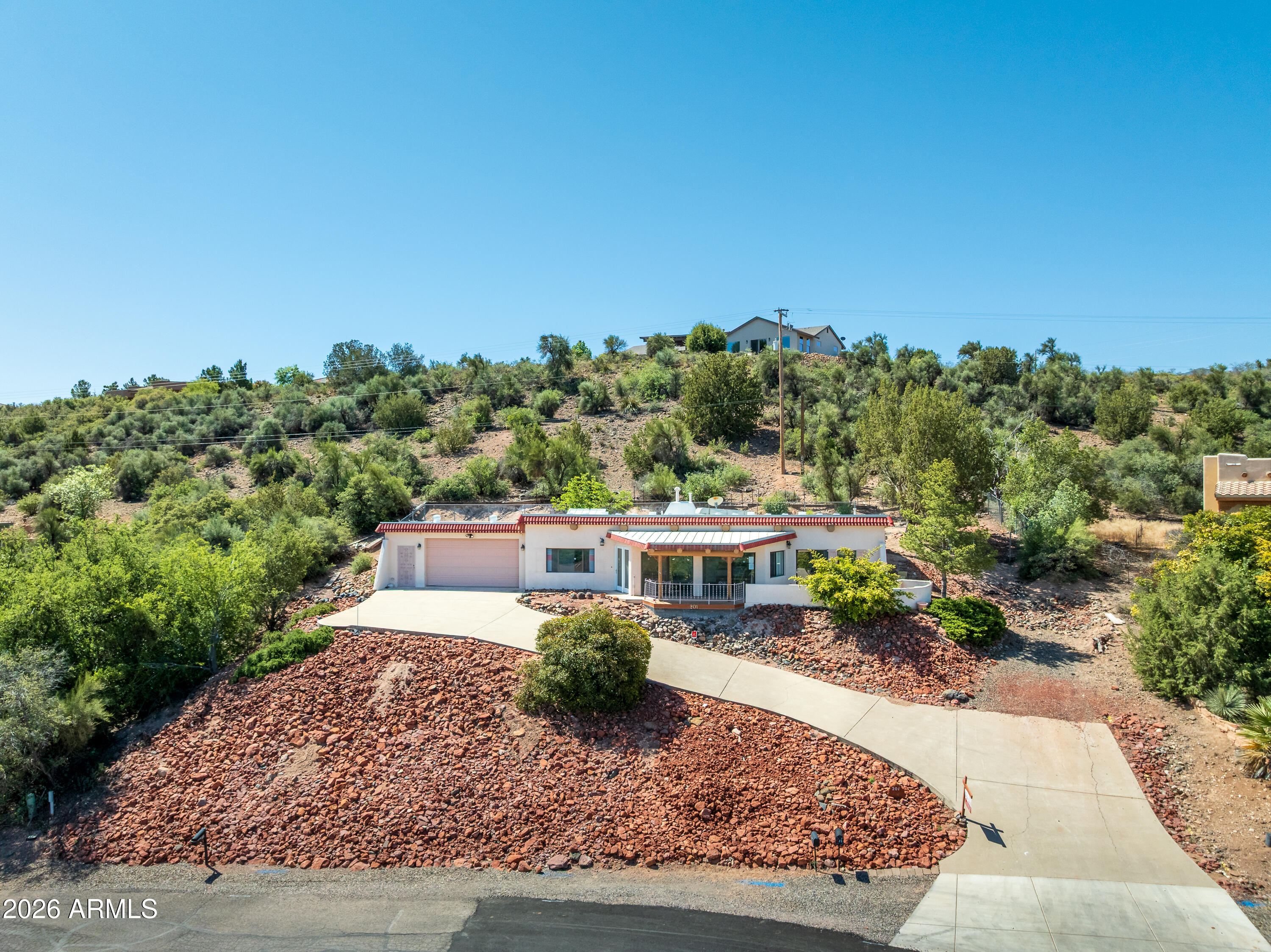 A front-row seat to Sedona's red rock beauty. This 2BR/1.5BA Santa Fe home offers sweeping valley views and striking crimson rock backdrops. Authentic viga beam ceilings bring warmth and character, while the expansive deck and patio create an inviting setting to take in the surrounding scenery. With the opportunity to update and make it your own, this property presents the perfect blend of charm and potential. A sought-after location, timeless style, and views you'll never tire of.