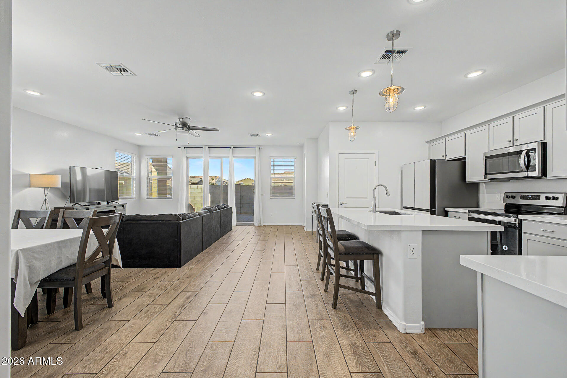 Built in 2020 and located in Goodyear's desirable Centerra community, this 3-bedroom, 2-bath home offers modern, low-maintenance living in an exceptionally convenient location. With 1,525 SF, an open-concept layout, and a 2-car garage, the home is designed for easy everyday living and a true lock-and-leave lifestyle. Residents enjoy access to the community pool and are within walking distance to shopping, dining, entertainment, and the new 86-acre Goodyear Recreation Campus featuring parks, an aquatic center, fitness and recreation spaces, and year-round activities. Conveniently located near Goodyear Ballpark and spring training. Newer construction means added peace of mind with newer major systems, roof, and HVAC, and solar panels that result in average APS bills of only $17/month!
