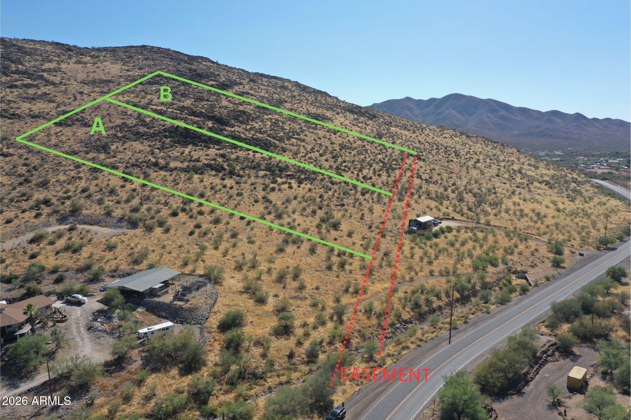 Exceptional 5-acre parcel (A) in New River offering stunning north-facing mountainside views across the valley. The elevated lot is perfectly positioned to take full advantage of the panoramic views, making it ideal for a custom home with expansive windows designed to capture the scenery and natural light. Enjoy privacy, open space, and breathtaking sunrises and sunsets in a peaceful desert setting. An 40-foot road abandonment is available for access. With plenty of room for a custom residence, garage, workshop, horse facilities, and recreational vehicles, this property offers the perfect blend of rural living and convenient access. Lot can be split into multiple lots. Buyer to verify all facts and intended uses. Lot B available separately or together.