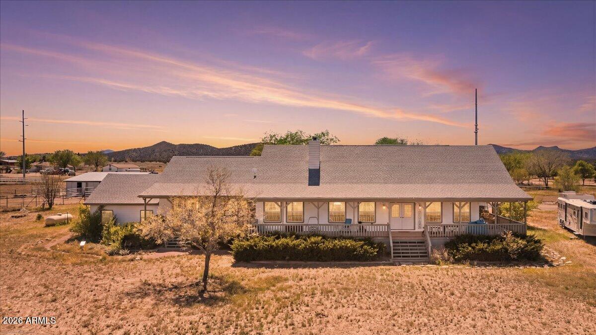 Here is the HORSE LOVERS ''Paradise'' on 5 Fenced/Cross Fenced Acres with 36'x45' Stall Horse Barn, Tack Building w/Power, 12'x16' Mare Motel. Property has 2006 SF house + 672 SF In-Law Set up accessed from the main house for a total of 2678 SF located less than 2 miles from World Famous ''GUNSITE ACADEMY'' making this property Excellent Potential for VRBO or AIR B&B investment property. This Western Style home has a Wrap Around Veranda, 4Bedrooms/3Bathrooms/2CarGarage, Wide Plank Knotty Pine Flooring throughout, GREAT ROOM Concept, Stain Grade Doors/Sill Plates/Baseboards, Vaulted Ceilings, Ceiling Fans, Plant Shelves, Woodburning Fireplace w/Brick accents, Upgraded Lighting, & Outstanding Window Coverings. Kitchen is well appointed w/Knotty Alder... Cabinetry, GRANITE Countertops, Huge 6'x7' Butcher Block ISLAND w/Breakfast Bar, 2020-Stainless Steel Appliances, Tiled Back Splash, Gas Range/Oven, Soft Close Doors & Drawers, & Dovetailed Drawers. Master Suite is Spacious, Large Walk-In Closet, Dual Copper/Vessel Sinks on Dresser Styled Vanity, Clawfoot Bathtub, Large Tiled Shower, & direct Access to Veranda. Additional Features include Guest Bath w/large Shower & Vessel Sink, Large Laundry w/Storage, Gazebo, 12GPM Well, & has Fantastic VIEWS. In-Law Set up mentioned above has Living Room, 1 Large Bedroom, Single sink, Shower, Gally Kitchen & Oak Cabinetry. You must check this out!!!! Round pen does not convey.